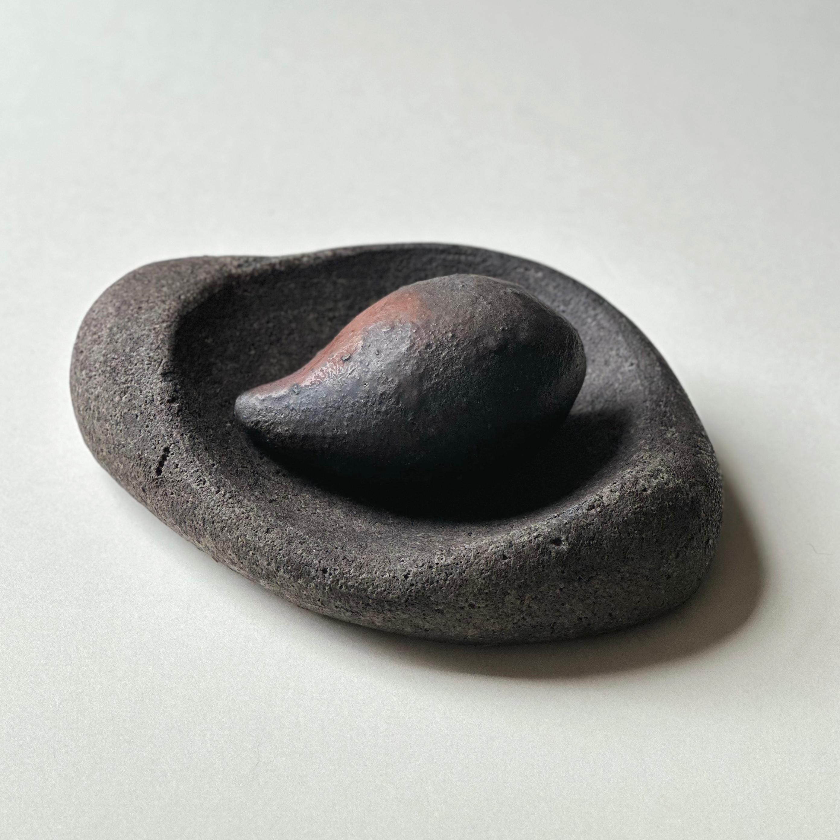 Free-form, wood-fired mortar and pestle made from blended clays hand-collected by the artist in Minnesota and California. Both signed with the artist’s mark. Food safe.

Mortar: 2 x 8 x 6.25