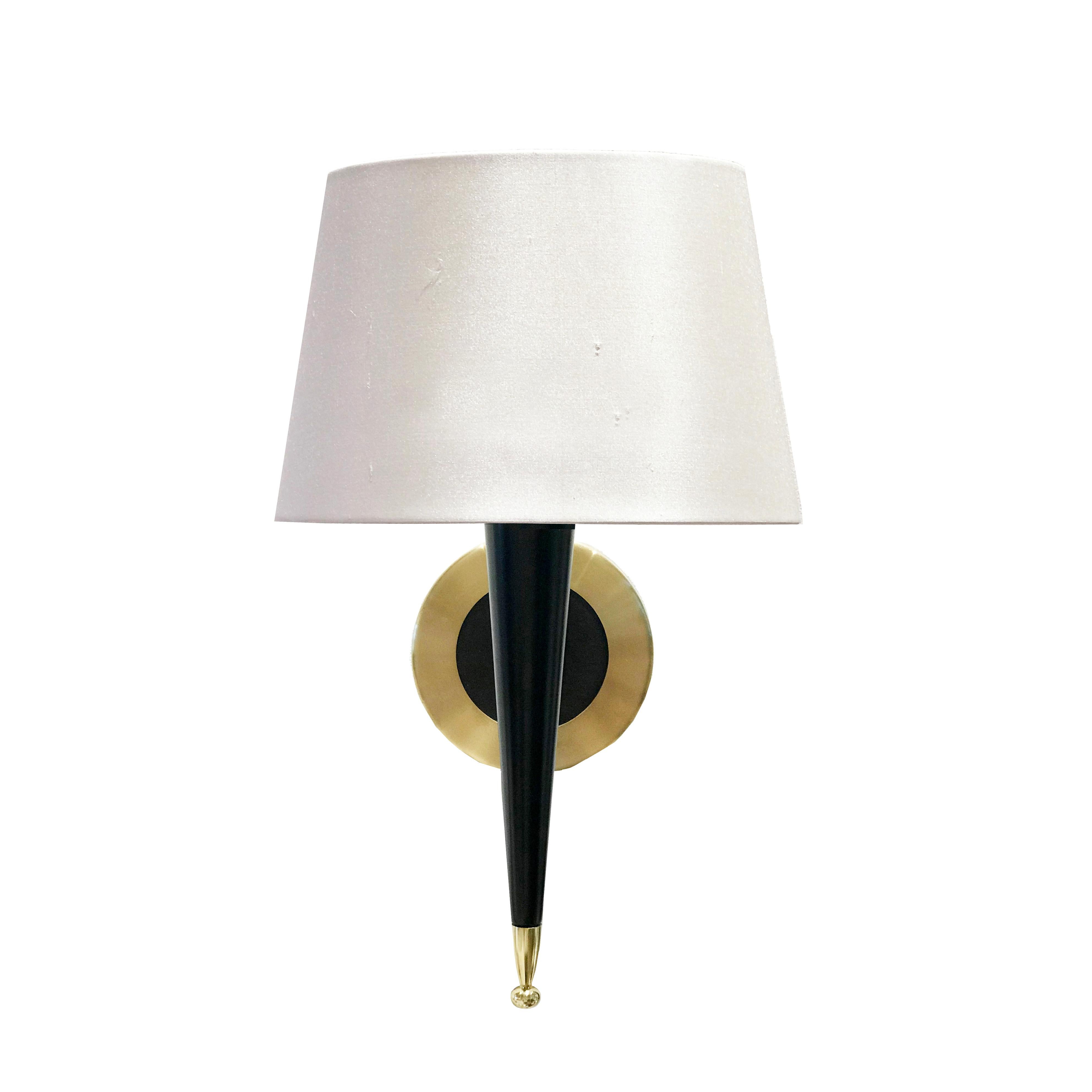 Ebonised wood and satin lacquered wall light with brass finish base. Lampshade is not included.

W13.5 x D15 x H30 cm

Currently in stock, 6 – 8 weeks lead time for large orders