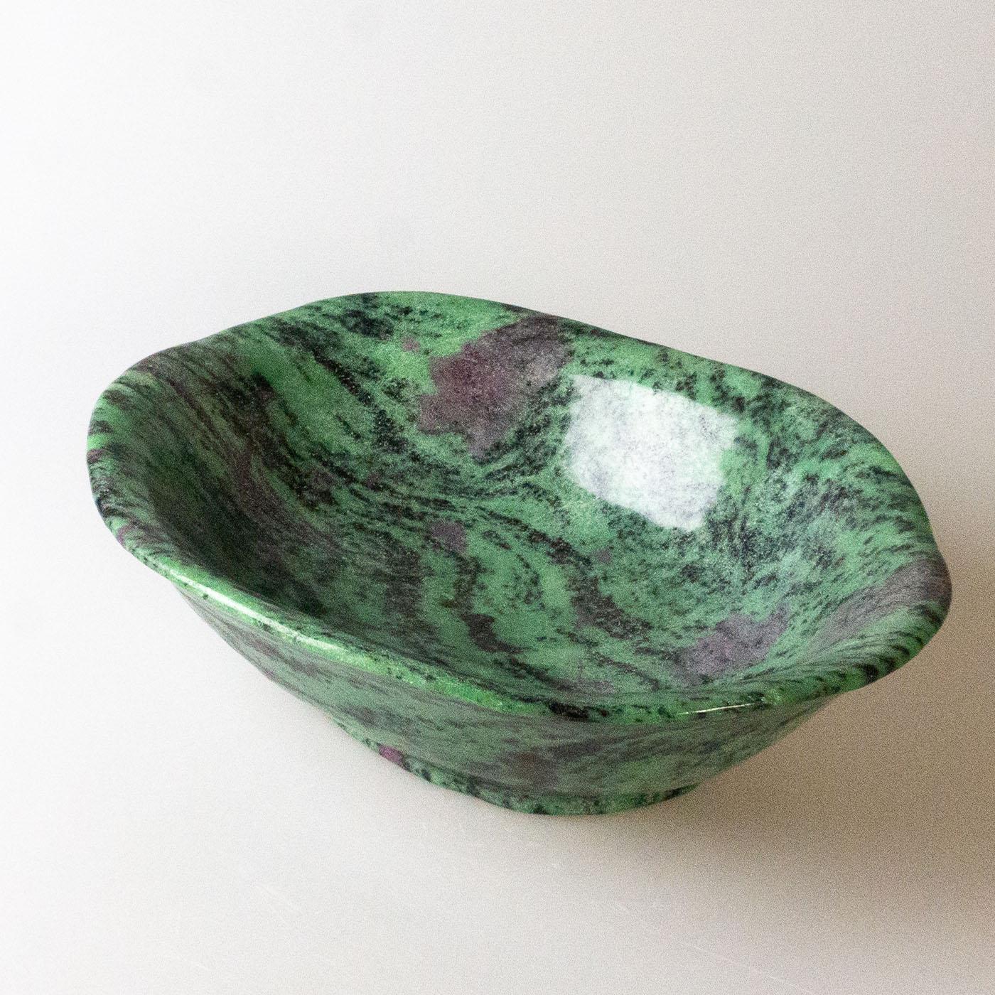 Cup with an irregular shape, made from a single block of zoisite ruby. The stone has a profound meaning: it gives freedom of thought, love for existence, confidence, physical strength, ability to concentrate, and will to win. It heals negative