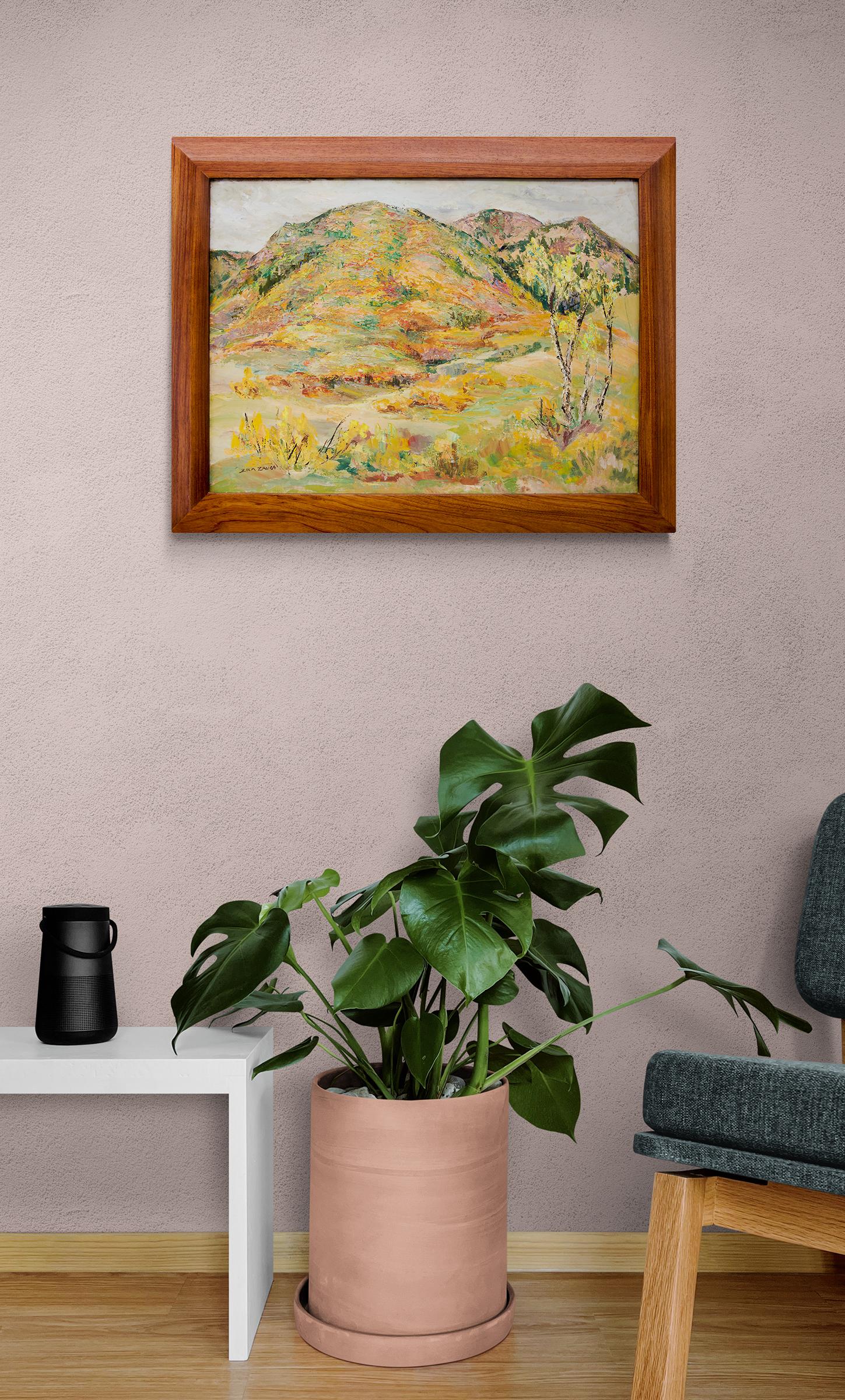 Vintage 1950s landscape painting of mountains near Colorado Springs, Colorado by woman artist, Zola Zaugg (1890-1983). Oil painting on masonite in fall colors of yellow, orange, green, brown, white and blue.. Presented in a custom hand carved wooden