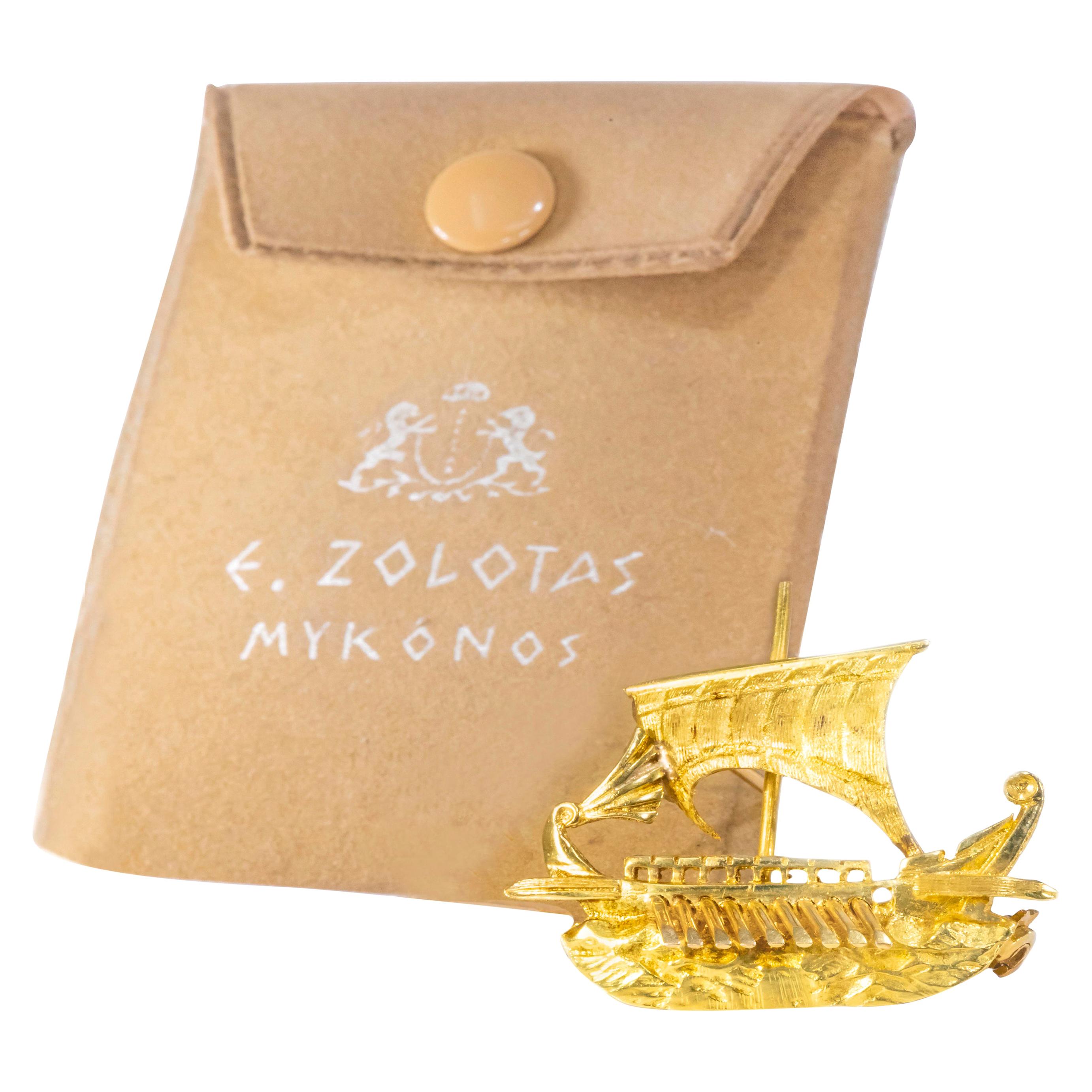 The present pin / brooch is made by the firm Zolotas who is famous for their acclaimed greek inspired designs which draw from Classic Greek Art  and far away travel. The firm is known for their concepts which are elaborated in 18kt and 22kt yellow