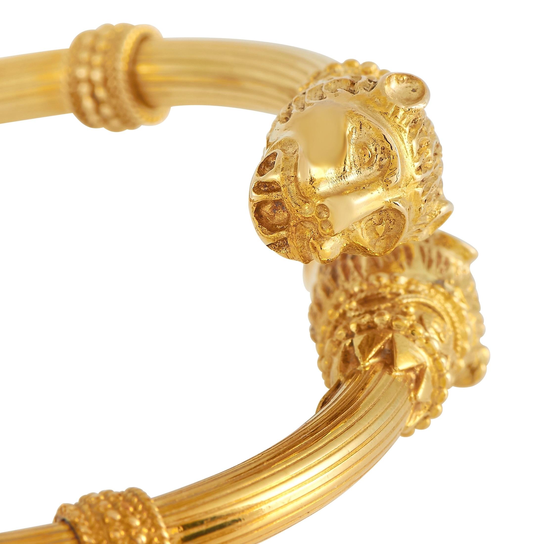 Regal and incredibly opulent, this stunning Zolotas bracelet will add elegance to any ensemble. The bold design comes to life thanks to opulent 18K Yellow Gold, panther head accents, and a design that appears to delicately wind around the wrist. It