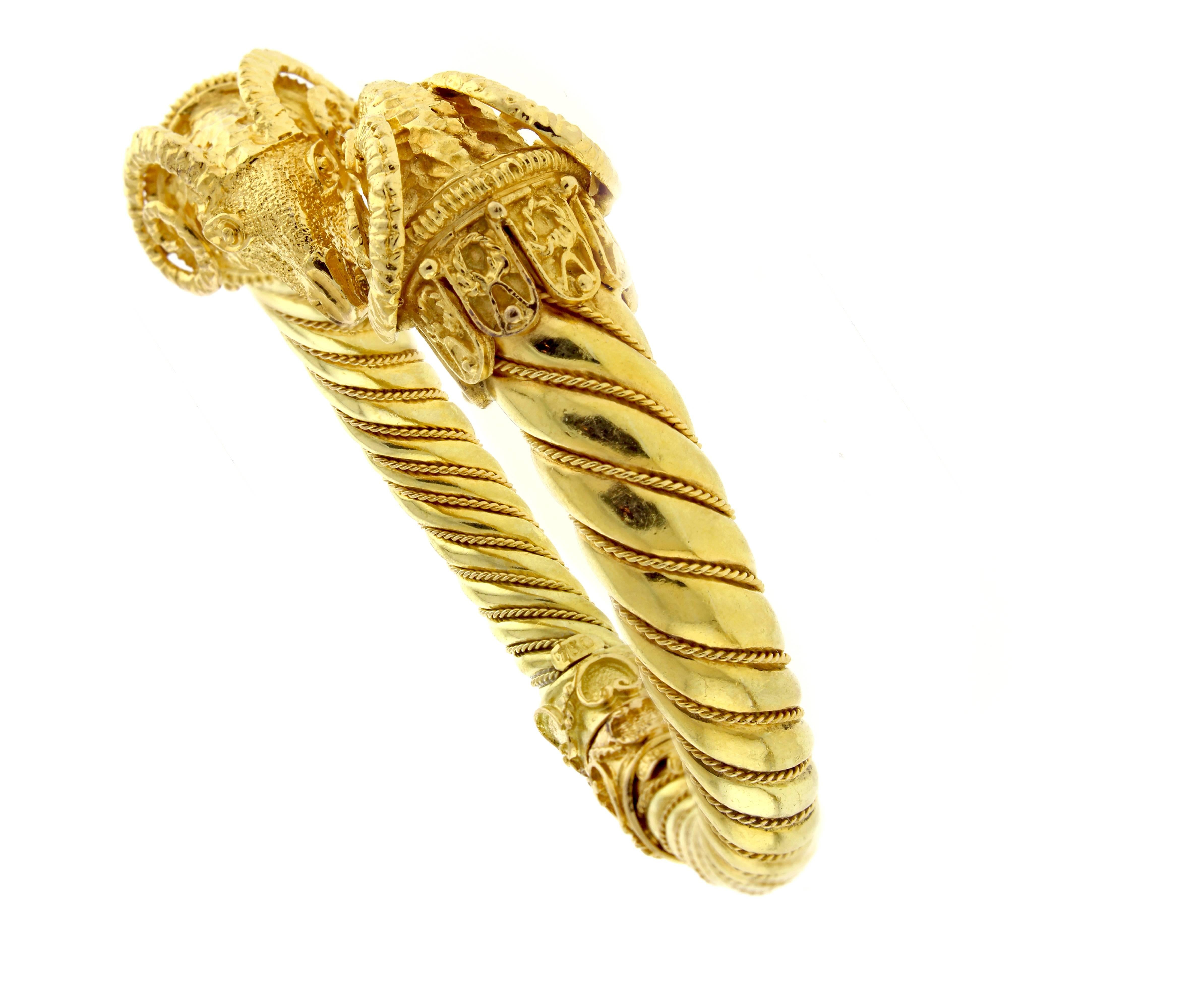 From acclaimed Greek jeweler Zolotas, this  absolutely fabulous double ram head hinged 18 karat gold bangle bracelet. Fit a six inch wrist 65.1 grams