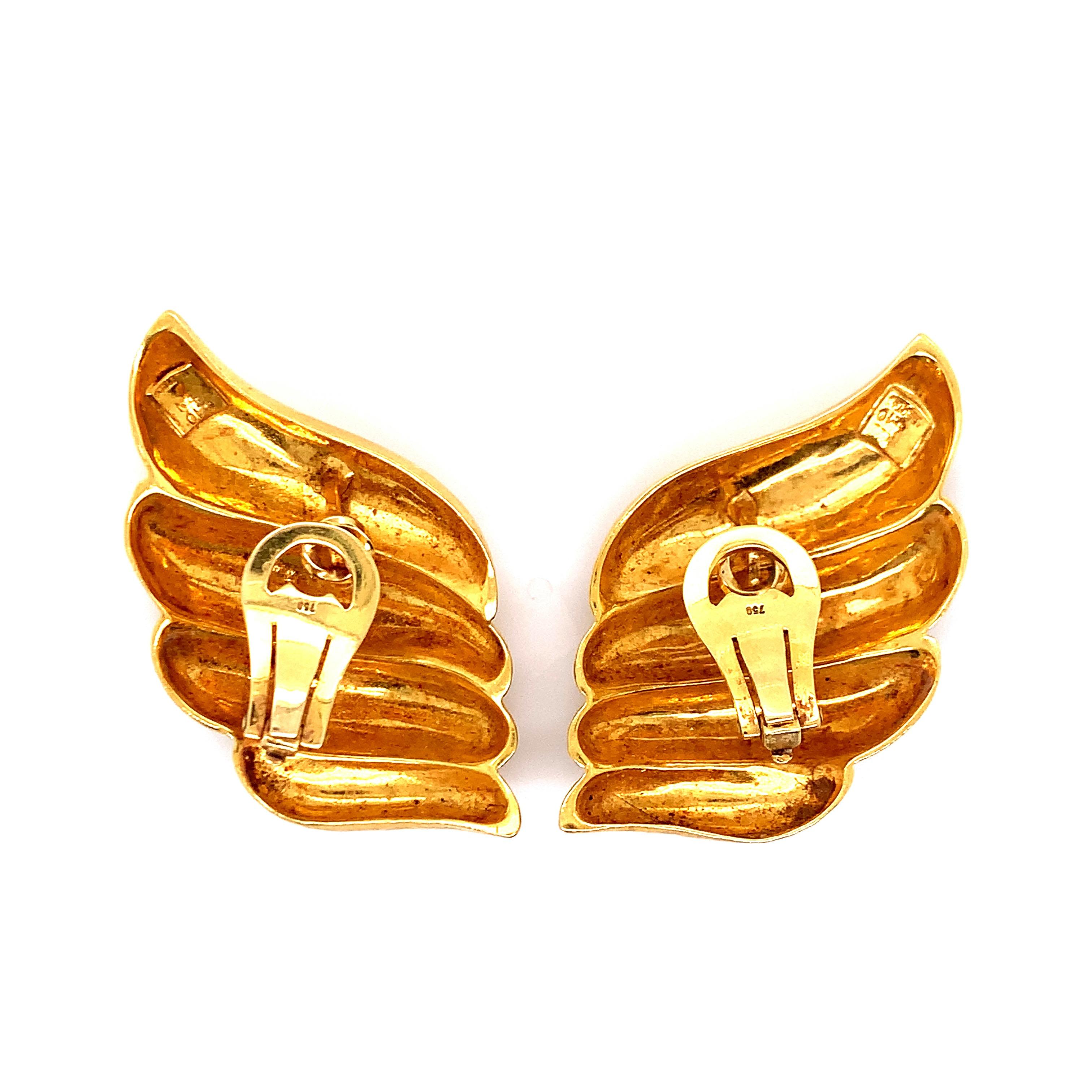 A pair of 22 karat gold ear clips, with a weight of 33.7 grams. Signed Zolotas. 