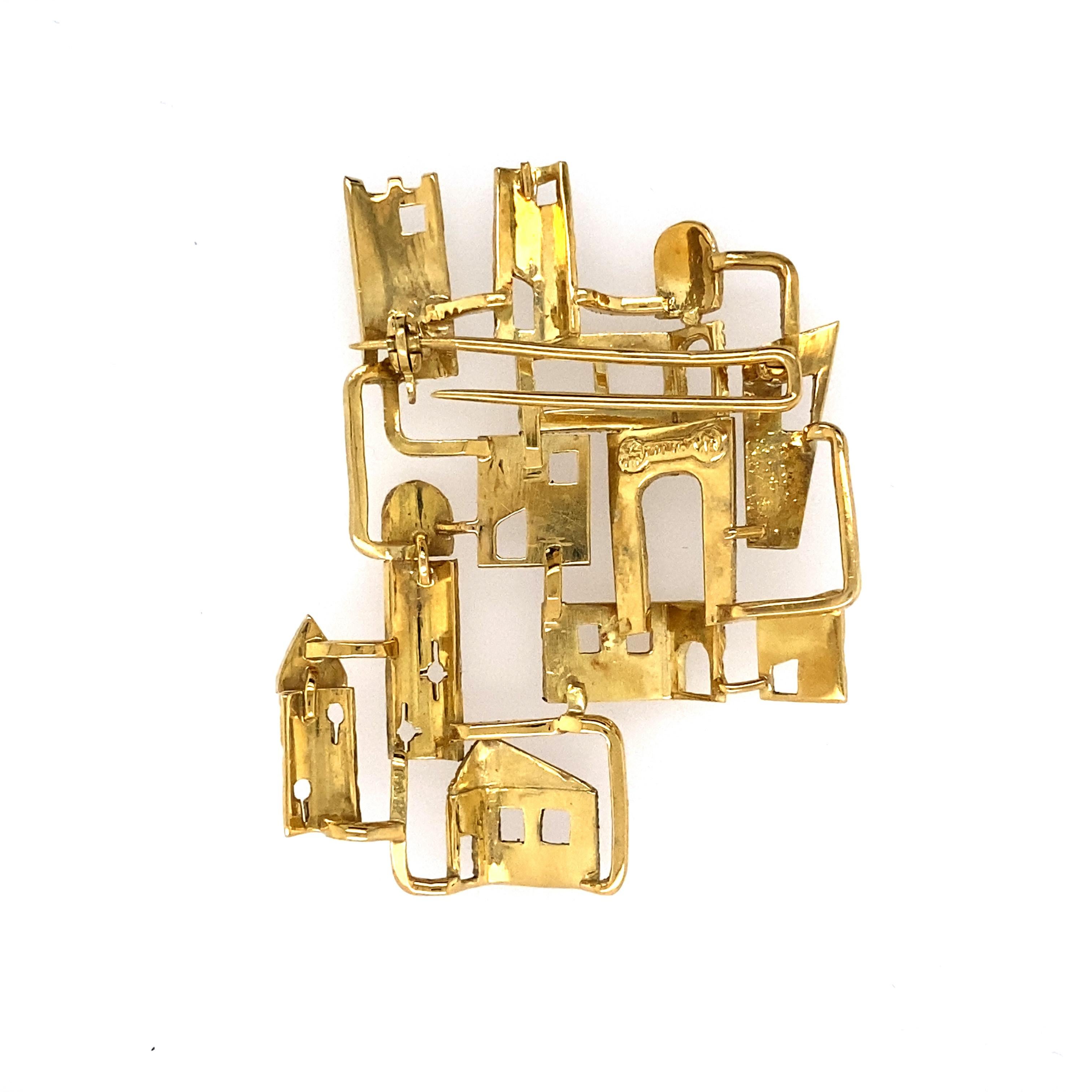 18k gold village Brooch, signed Zolotas, approximately  10.4 dwts
Size 2 1/8 x 1 5/8 inches.
