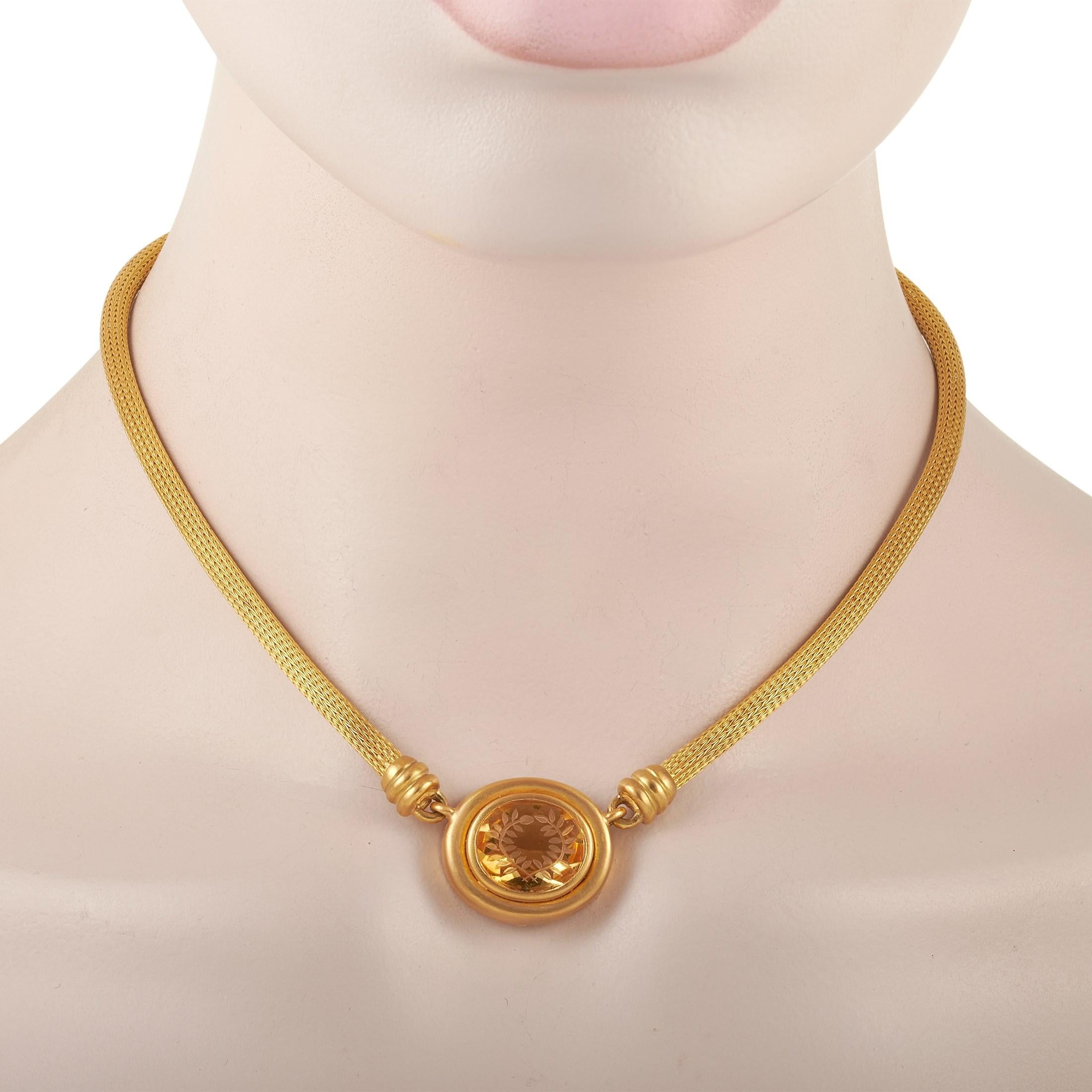 You can count on the bejeweled beauty of this piece to give your looks some character. The Zolotas Intaglio 18K Yellow Gold Citrine Vintage Necklace features a honey-colored citrine gemstone bezel-set on a round pendant. Inspired by mythical Ancient