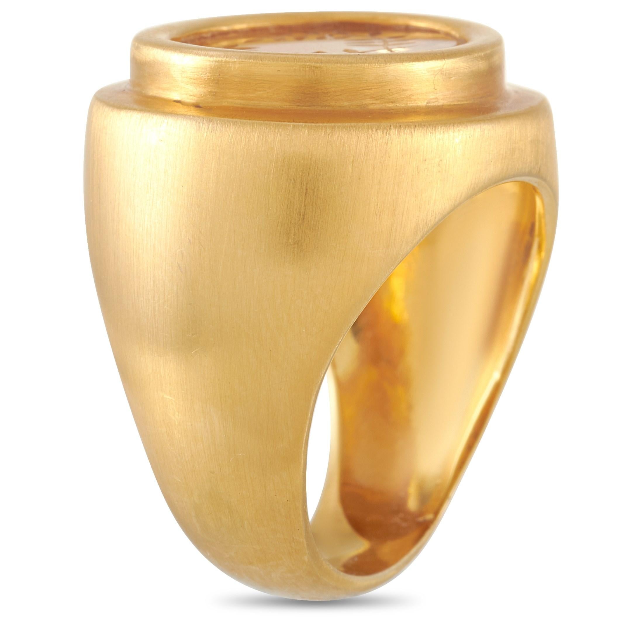 This vintage Zolotas Intaglio 18K Yellow Gold Citrine Ring is designed with a solid, chunky band that is 8mm thick with 5mm top height and 18mm by 20mm top dimensions. A hand-carved laurel wreath can be seen on the citrine gemstone set in rub over