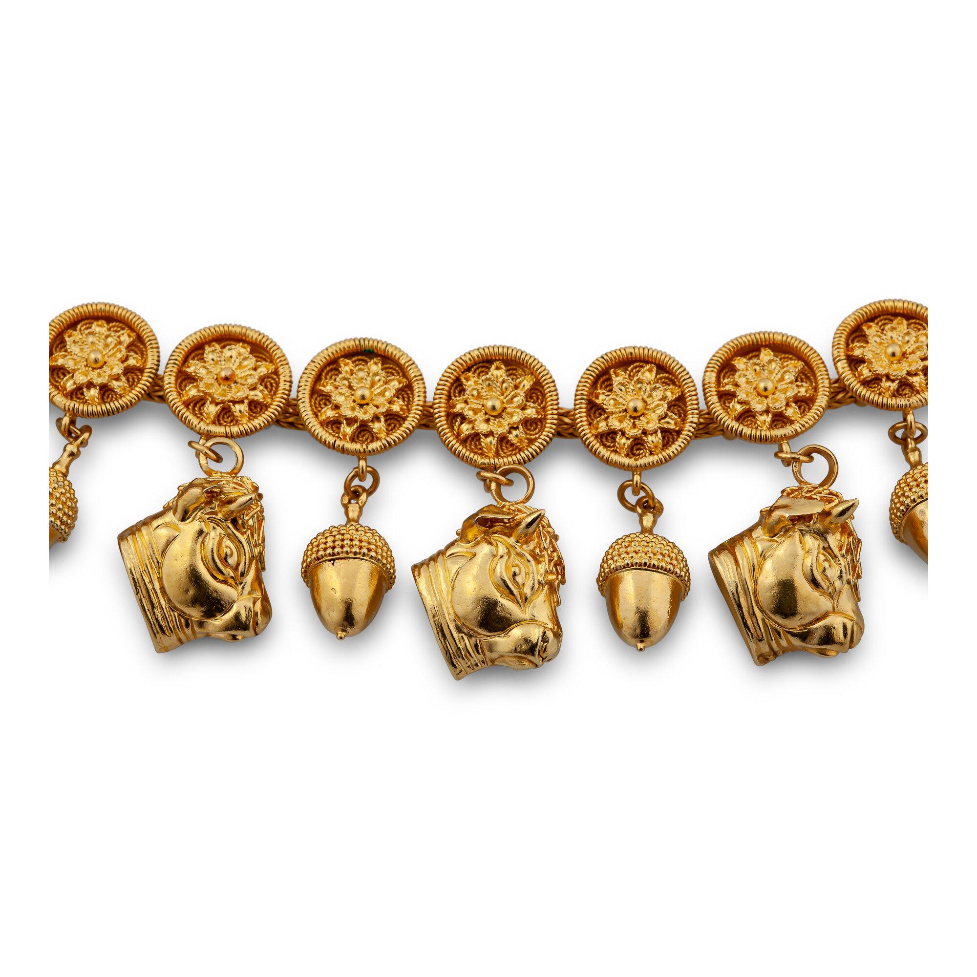 The strong bull and the mighty acorn symbolize eternal power, and this 22 karat yellow gold Zolotas necklace has both in abundance.  With seven bulls and fourteen acorns, each hanging from an intricately detailed floral disc, this 15 1/2 in length