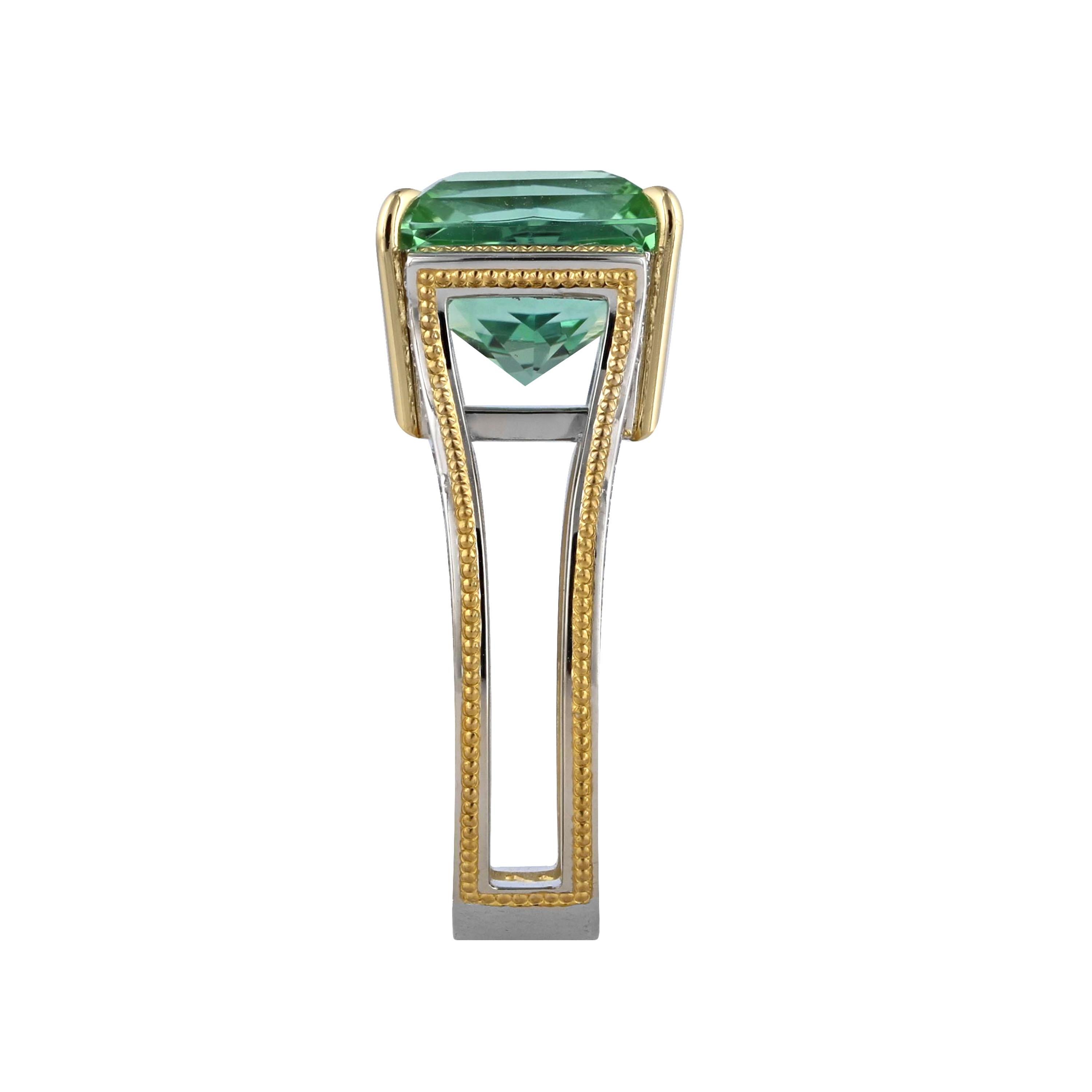 Spectacular 5.80 ct. teal colored Tourmaline set in Platinum and accented with seventy-two round brilliant diamonds with a total weight of .58 ct. of DEF color/ Internally Flawless to VVS clarity Ideal cut Diamonds. 18K Gold prongs and 24K Gold