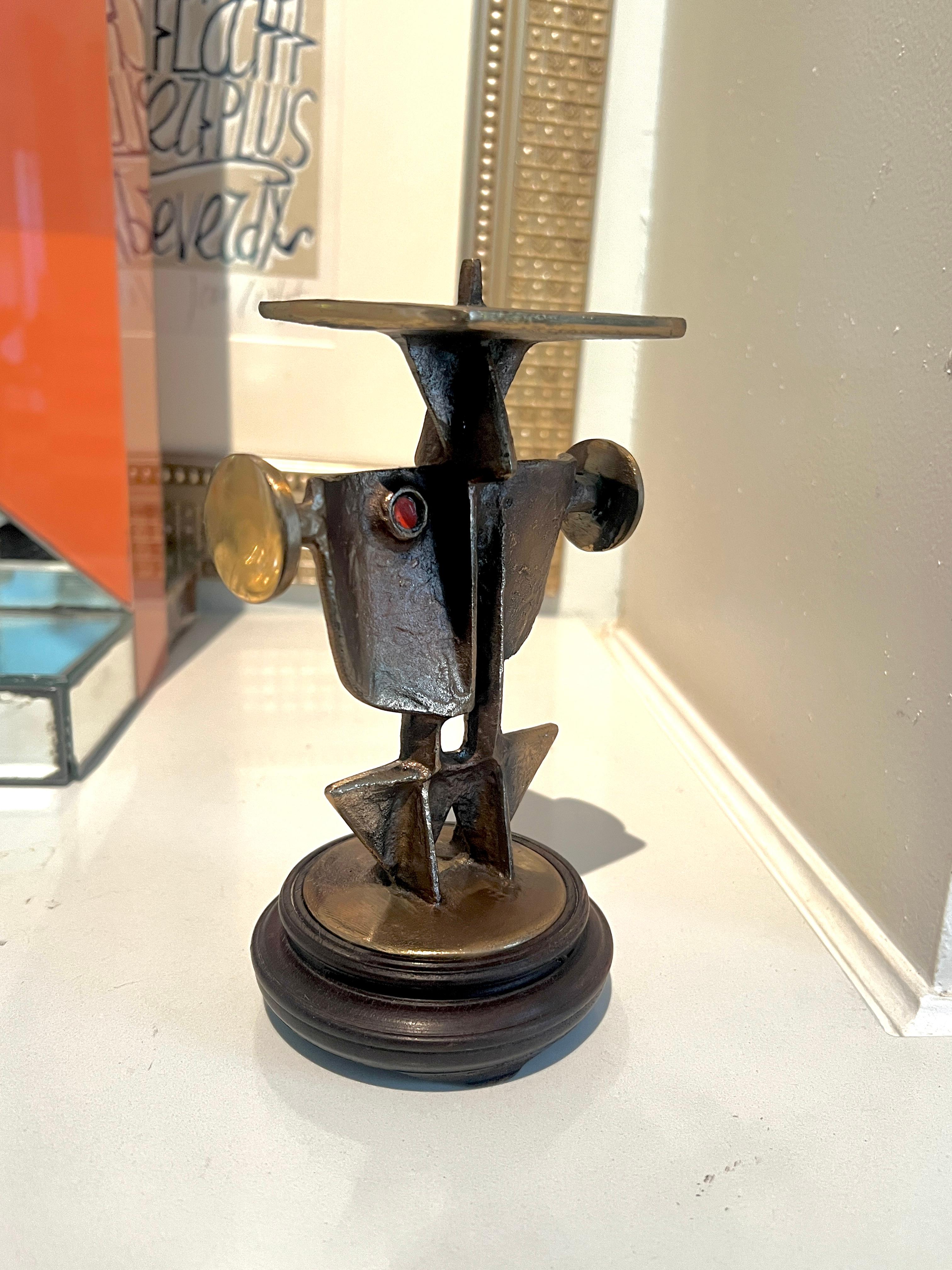 A brutalist cast bronze candlestick by Hungarian sculptor, Zoltán Pap.   

The piece is so special, when it's not being used as a candlestick it is still an intriguing sculptural treat.

A compliment to any space, and especially a grouping of