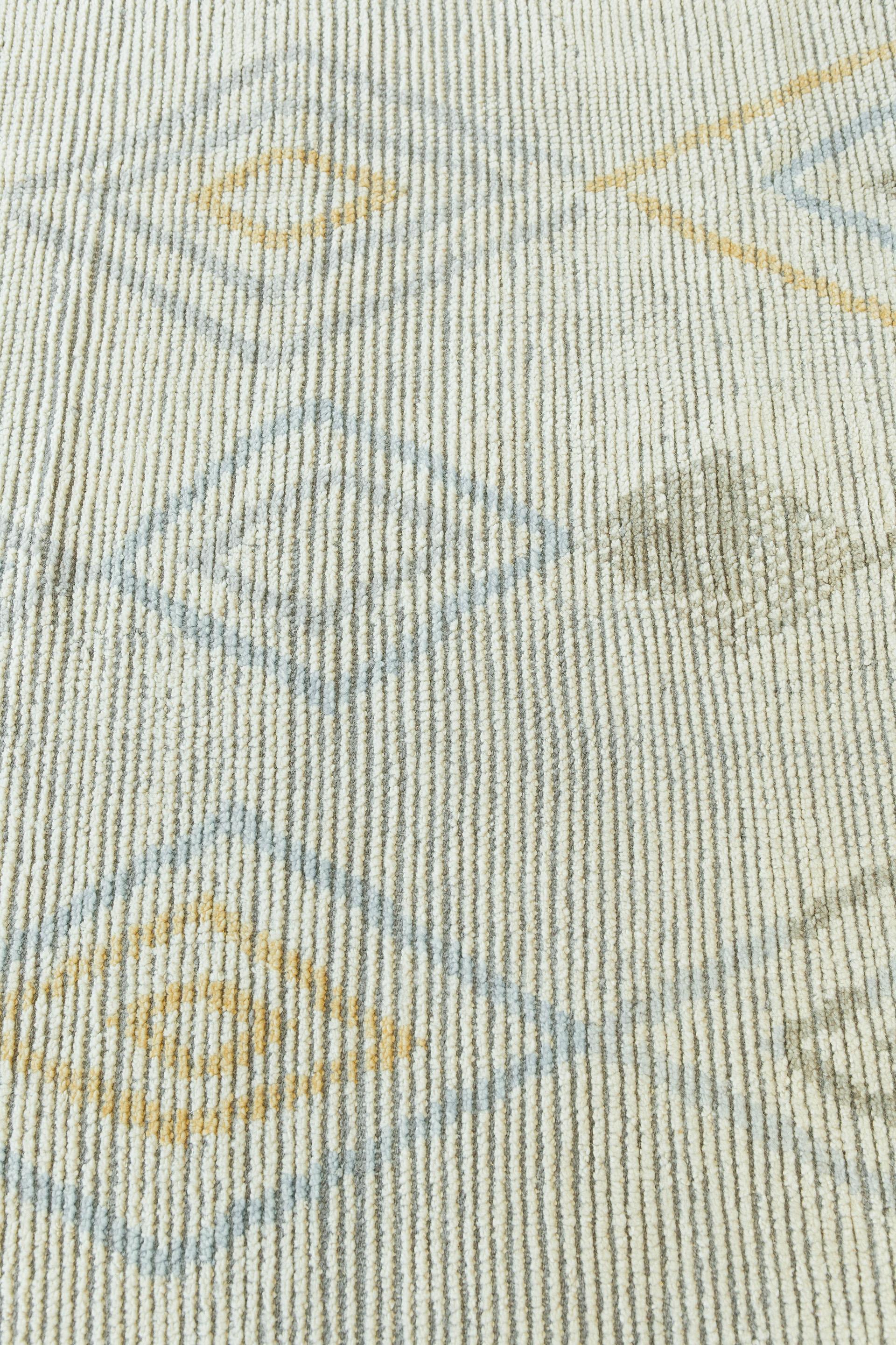 Dieser einzigartige Stammesteppich wurde in Los Angeles entworfen und ist vom Atlasgebirge in Marokko inspiriert. Das aus handgesponnener Wolle gewebte Rippenflor-Gewebe besteht aus einer reizvollen Oberfläche und intuitiven Rautenmotiven, die in