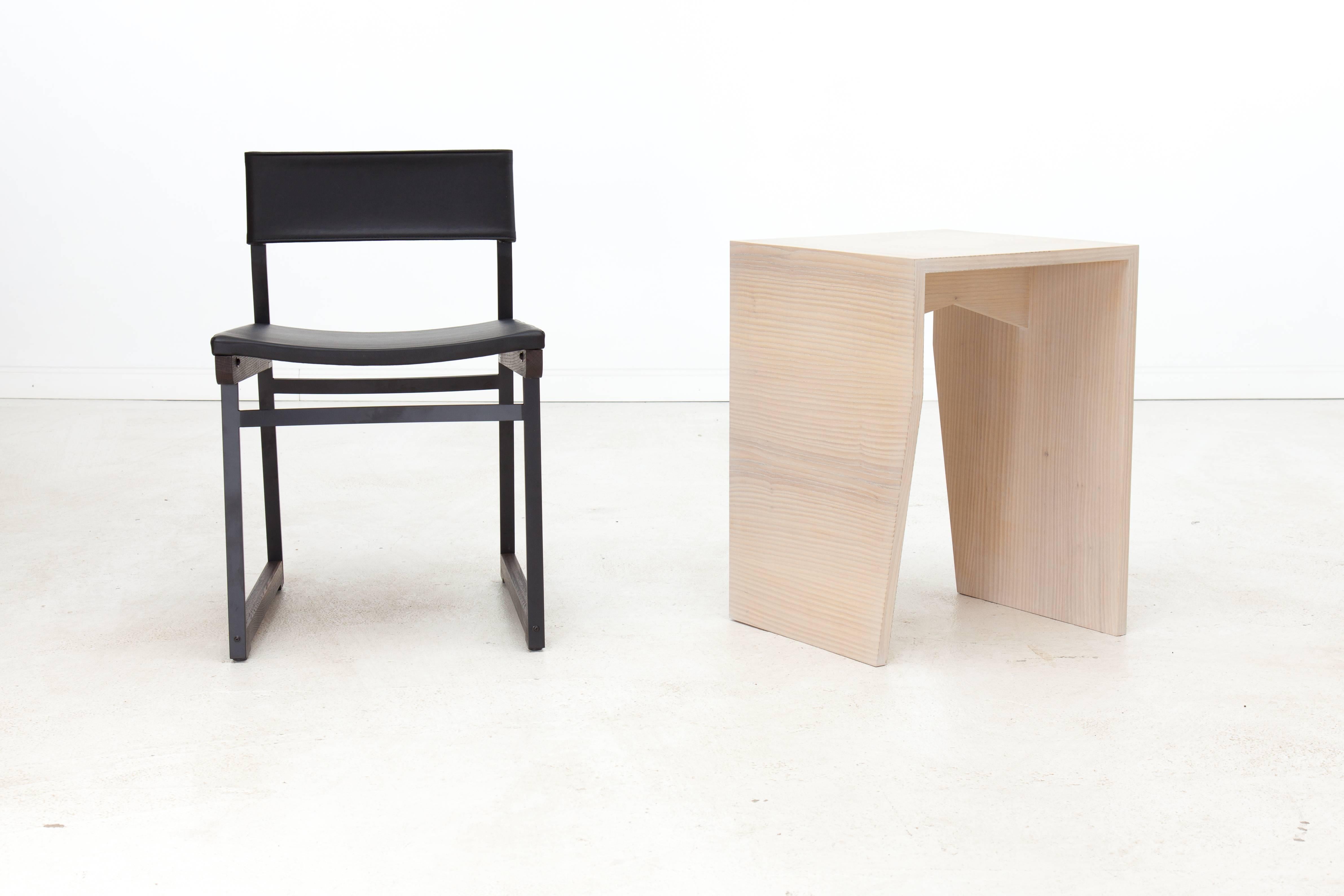 The angles and form of the Zooey side table are a nod to Brutalist architecture and Minimalist sculpture of the 1960s and 1970s. Shown in cerused ash and available in a variety of American hardwoods. The Zooey side table is made to order, so