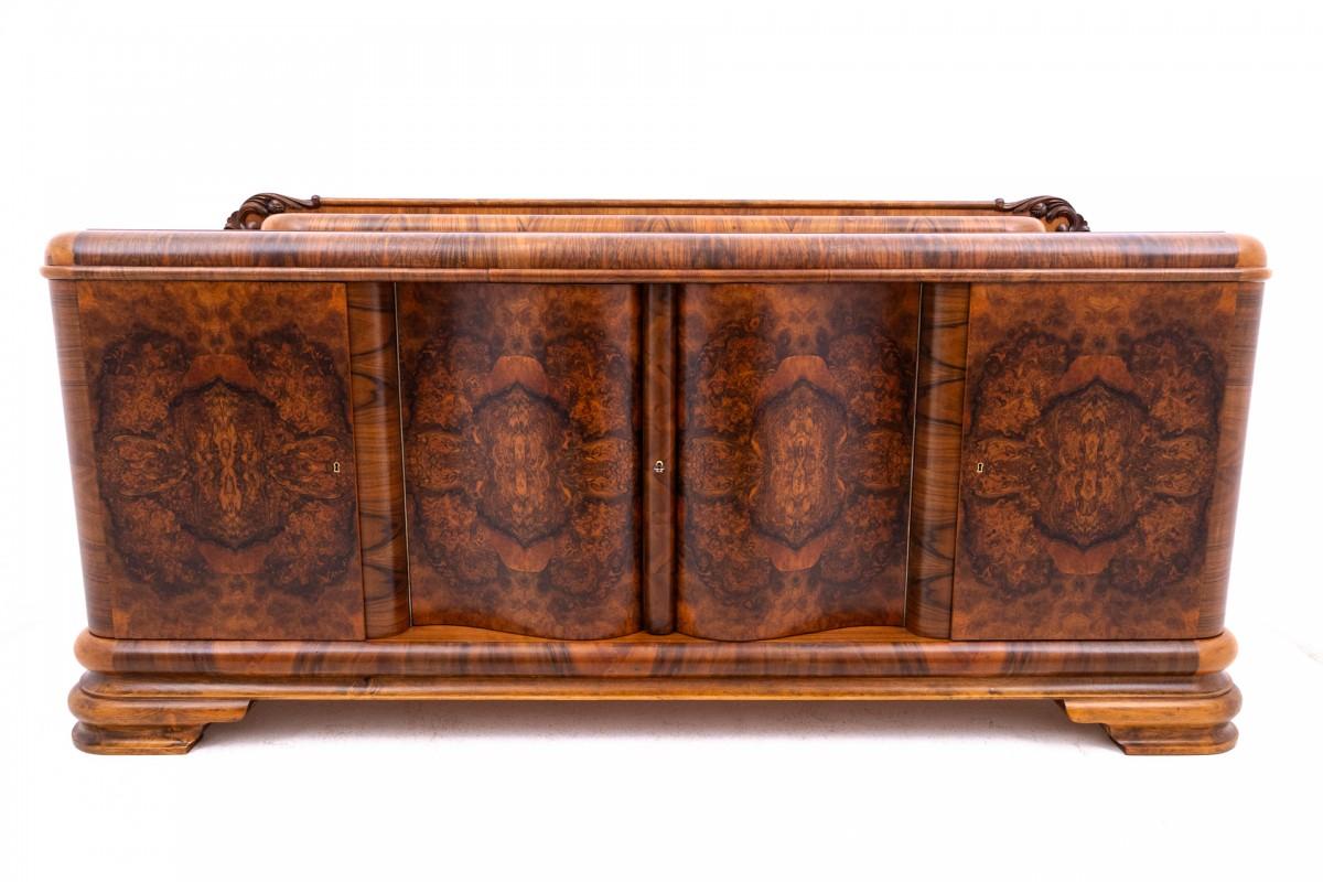 Art Deco chest of drawers from the 1940s, Poland.

A piece of furniture with a wavy, geometric form characteristic of the Art Deco style.

The chest of drawers has two spacious spaces, each with one shelf and one space with five drawers. Each space
