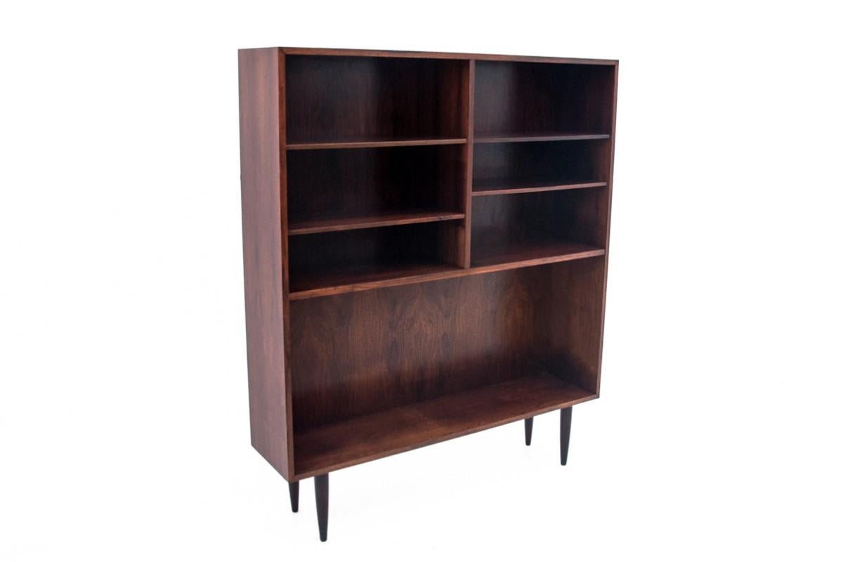 A shelf from the 1960s from Denmark, designed by Omann Jun Mobelfabrik. The furniture has an original label from the manufacturer on the back.

The upper part of the shelf is divided by shelves, placed at different heights, so you can easily place