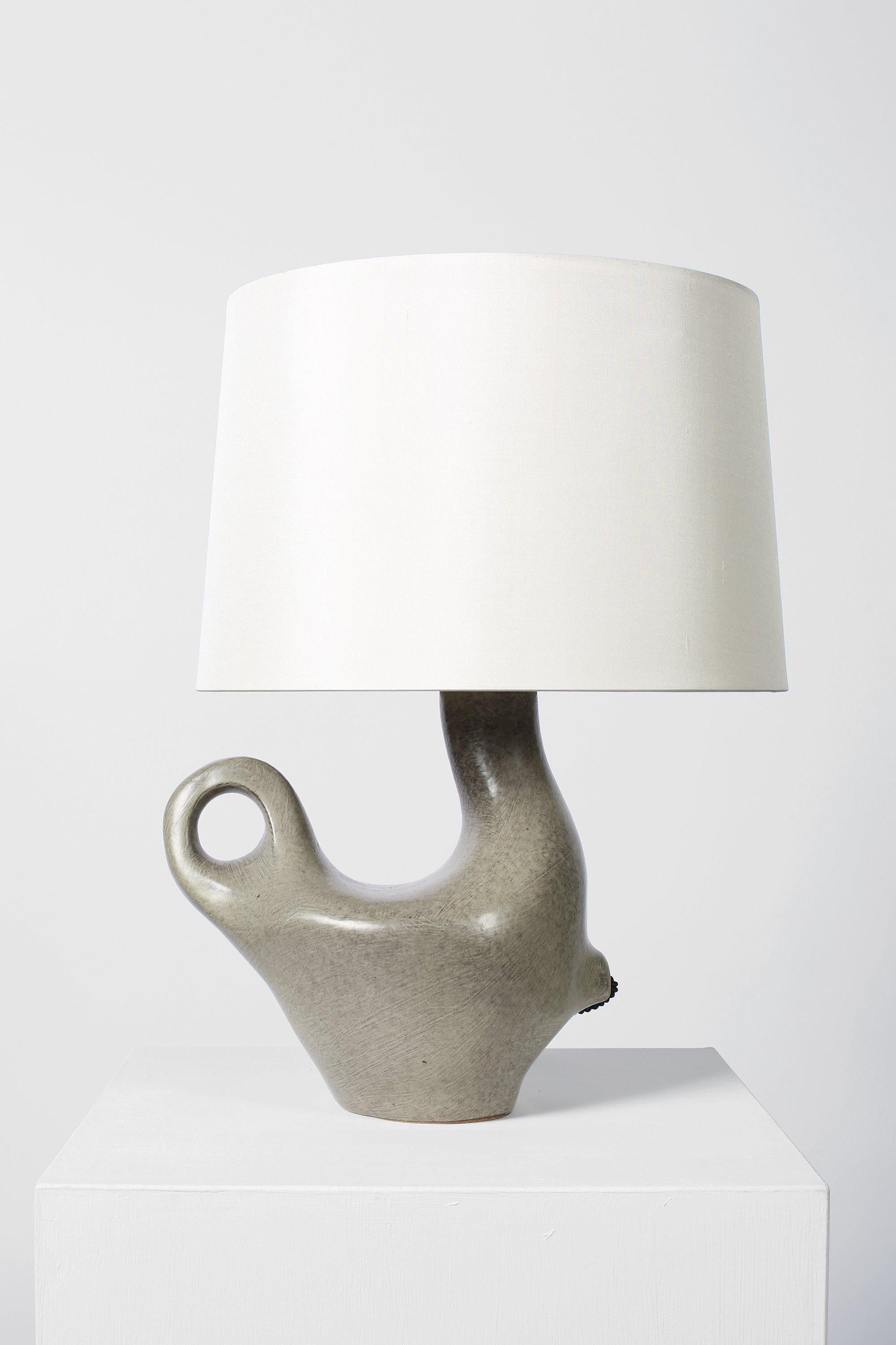 A mottled grey glazed ceramic table lamp of zoomorphic form by Max Idlas,
signed. 
France, 1960s.
Measures: 47 cm high by 35 cm diameter
---
Max Idlas was born in Marseilles, France in 1932 and moved to Paris in the 1950s to live in the