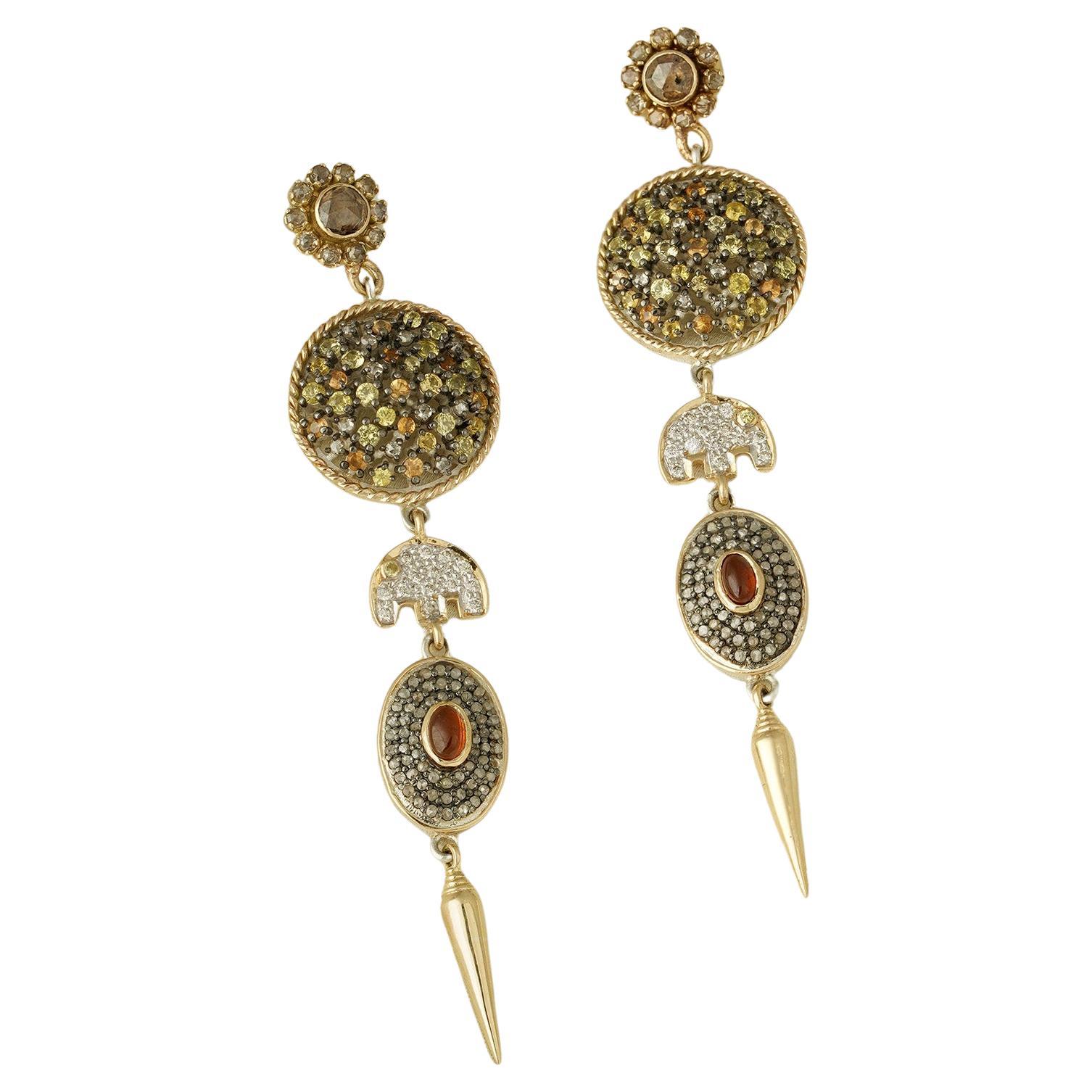 Gold(14K) : 9.56g
Diamonds : (VS clarity & H-I colour): (Brilliant cut) : 0.28ct
Rose-cut Diamond : 2.88ct
Gemstone : Yellow Sapphire, White Sapphire and Hessonite
925 Silver

The Zora earrings are an elegant concoction of elegant yellow and white