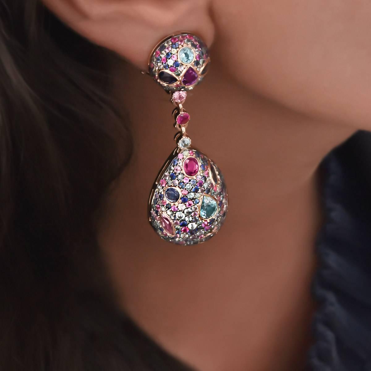 These stunning Zorab creations drop earrings are set in 18 karat rose gold and feature pave multi color sapphires inlaid with bezel set fancy shaped sapphires and blue topaz. 
Specifics:
Brown diamonds .64 carats
Sapphires 5.09 carats. 
Fancy Cut