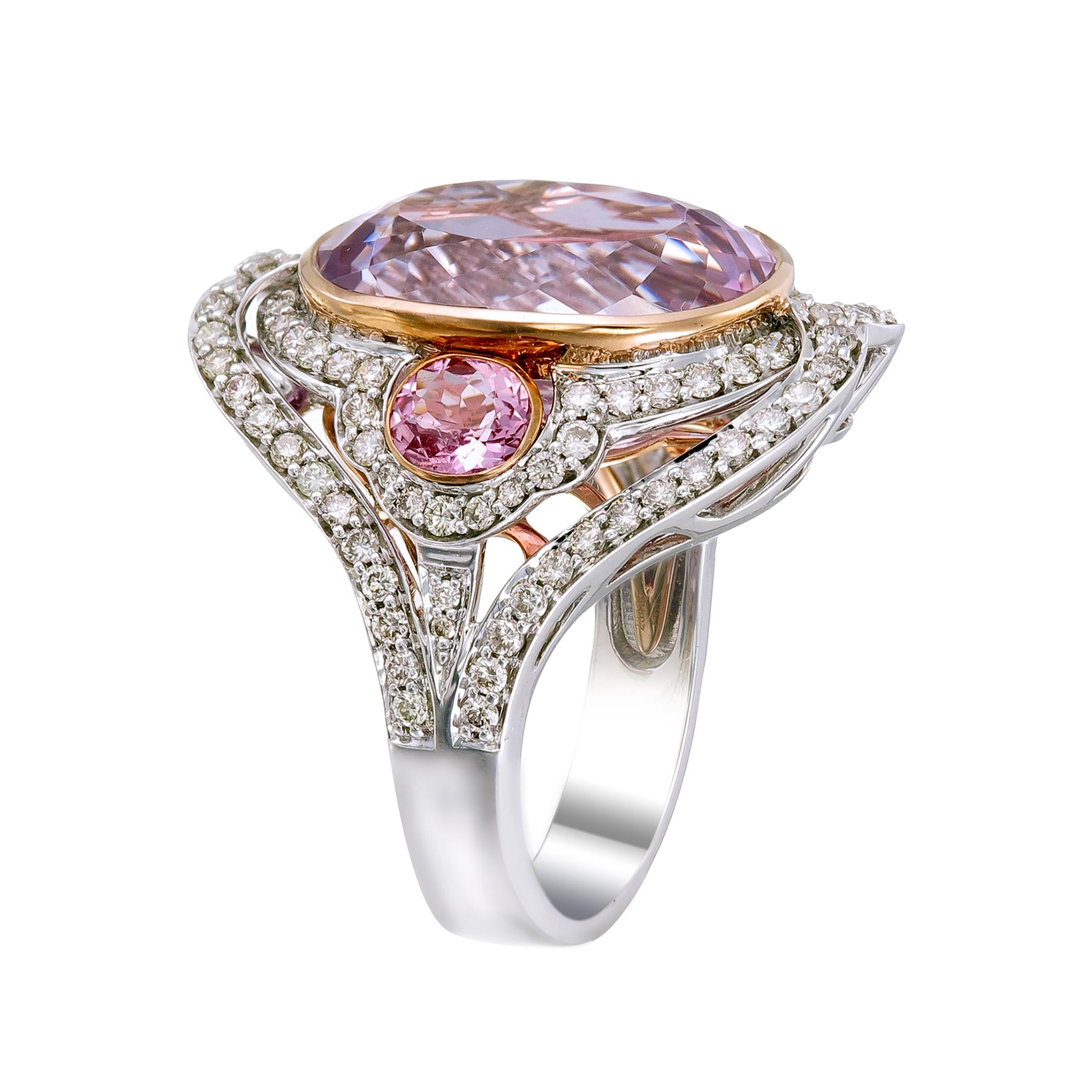 If pink is your color you will love this 18k white gold and palladium ring centered with a 14-carat pink Kunzite flanked by two 0.86-carat pink tourmalines lined with 1.04-carat diamonds. This finely crafted jewel is further defined with a personal