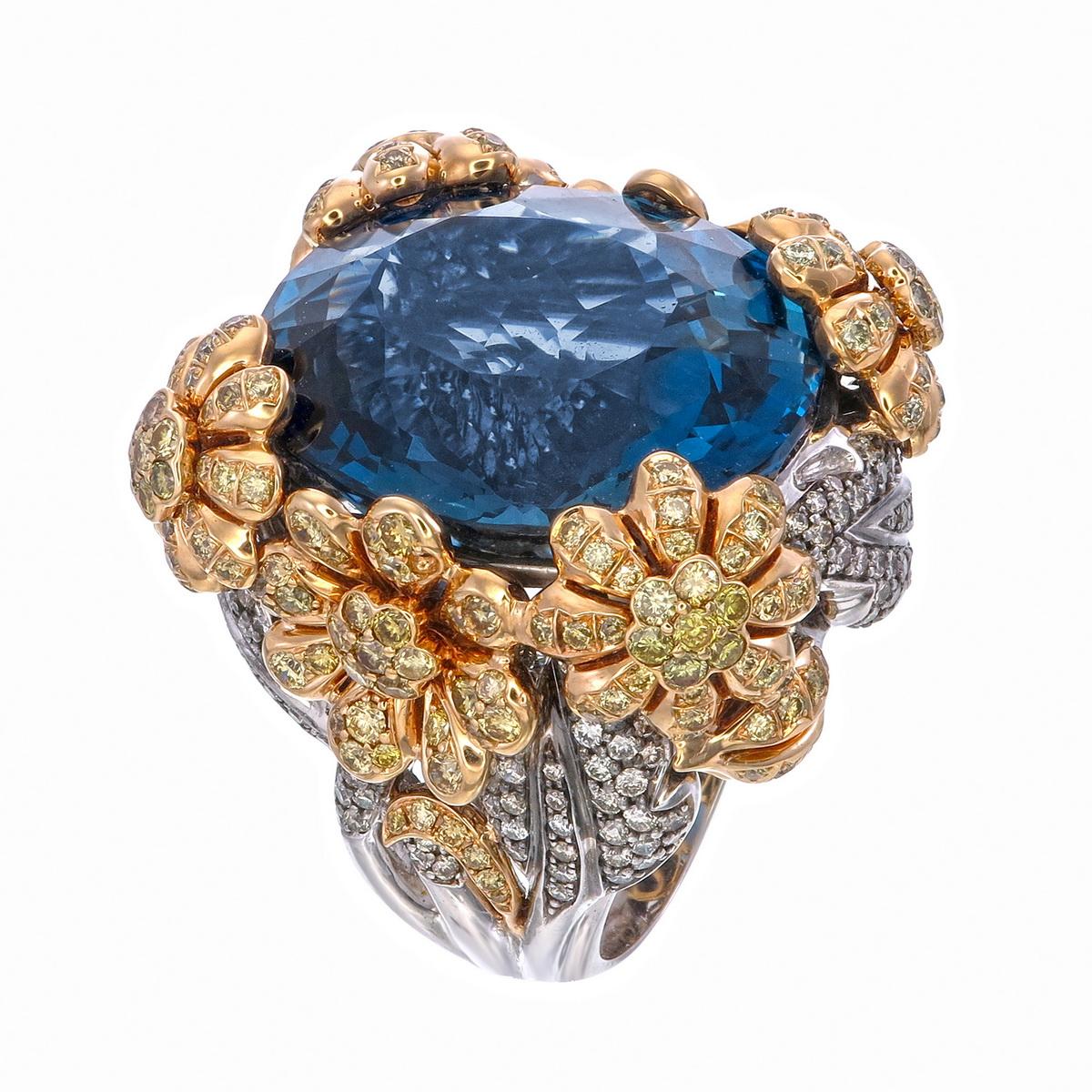 A 57.21-carat Blue Topaz Flowers Ring with 3.38 carats Yellow  Diamonds and 1.97 carats White Diamonds sounds like a stunning and luxurious piece of jewelry. Blue topaz is a semi-precious gemstone known for its striking blue color, and when set with