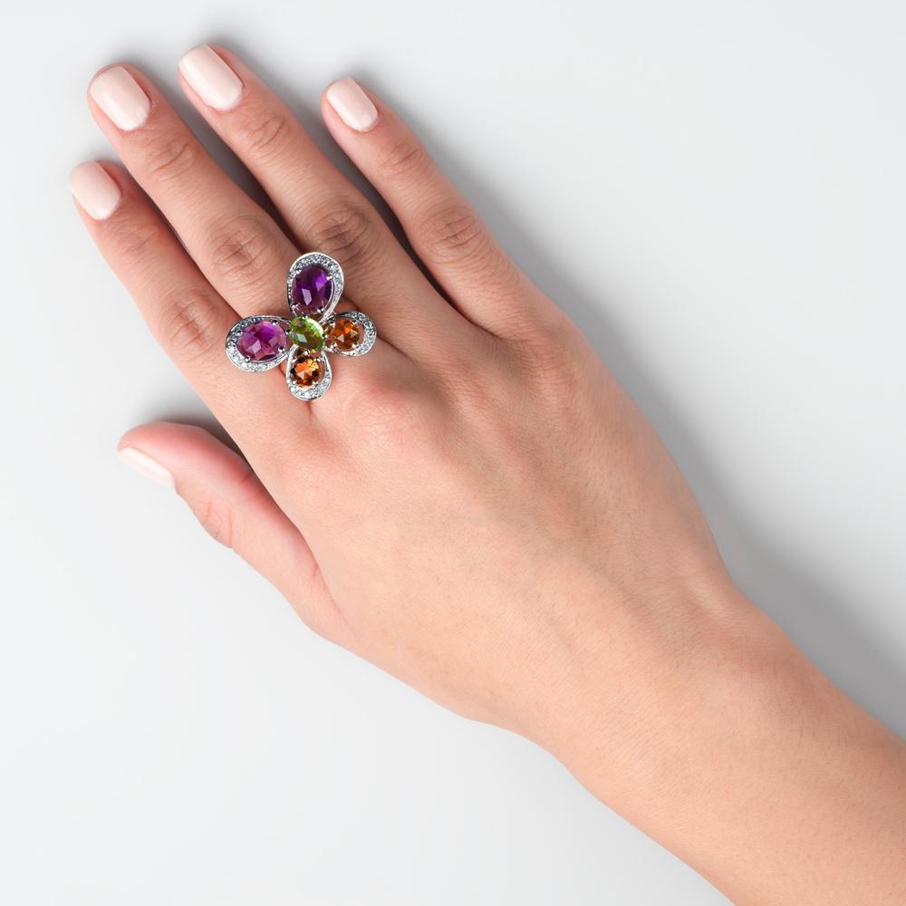 Perfect for those who like a flourish of color in their lives, this sumptuous butterfly style ring is ideal for adding a flutter of drama to your ensemble. 
This exquisite ring is crafted in 18K from a colorful plethora of gems including 3.65 Carat