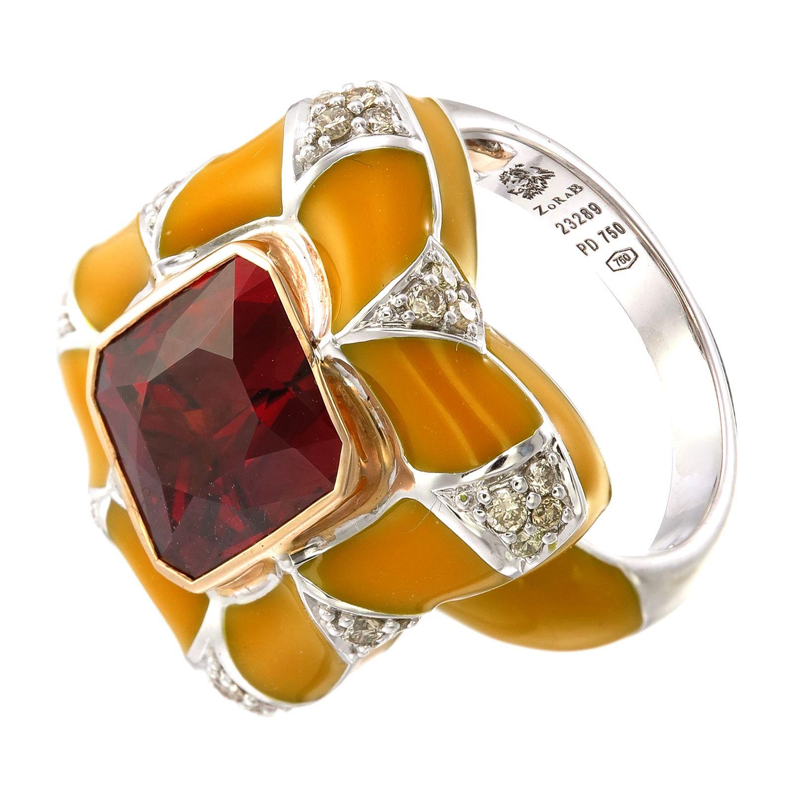 A 7.80-carat Spessartite Garnet on a pillow of yellow enamel encased in 0.41-carat Diamond-paved Palladium and 18K Gold can transform you to a magical place and a time long forgotten. 

This ring, as with all Zorab Creation pieces, are sent with a