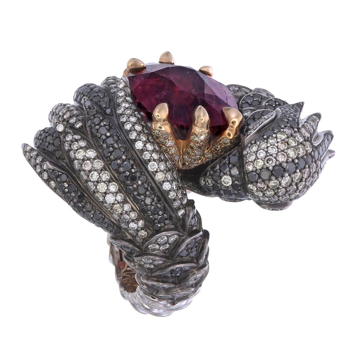 Sauvage Collection- one of a kind.
Unveil the dazzling 3.87-carats black diamond enigmatic eagle ring that possesses a vibrant 21.83-carats Rubellite in its claw. Beholds the exquisite play of 1.53-carats of fancy diamonds glazed and embodies the