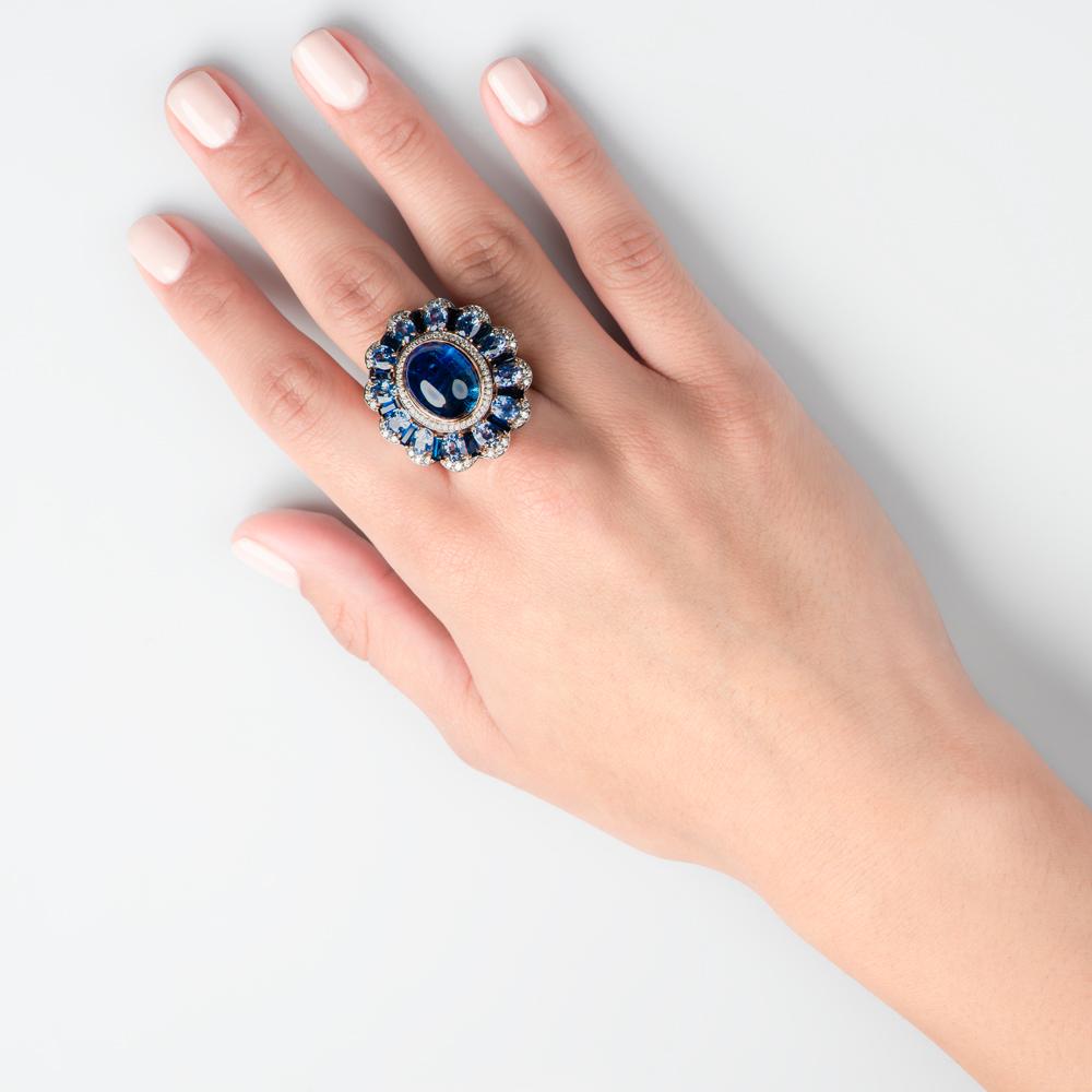 Bold is beautiful and this unique Zorab Creation Wreath Ring is both elaborate and exceptionally well crafted and designed. The central focus is a mesmerizing 9.27 carats Tanzanite which is shaped into an elliptical nest of yellow gold and 0.64