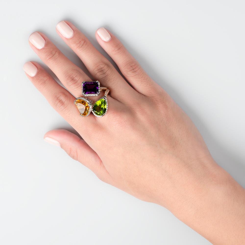 If you or a loved one is enamored by flawless gems, then look no further for the perfect adornment for your hand.  With an intricate and coveted mix of three different colored gems, you are certain to be the envy of all.

This gold ring features a