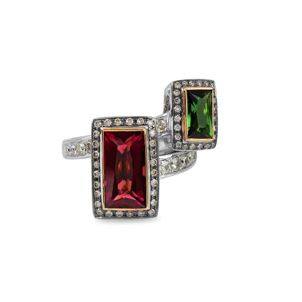 With the eye-catching contrast between the two distinctly colored gems, you are certain to fall deeply enamored with this beguiling and enigmatic ring.

Featuring two main stones; a 1.24 carat Green Tourmaline and a 3.66 carat Pink Tourmaline, both