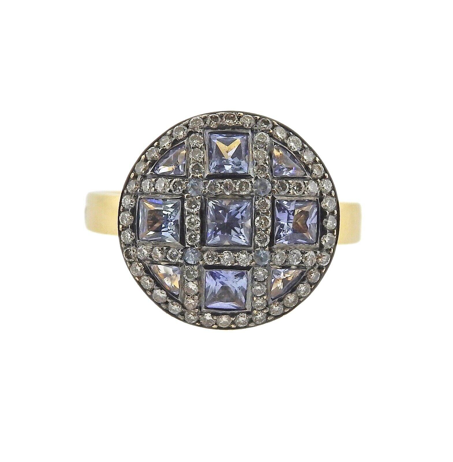 Zorab 18k yellow gold ring, features approx 0.22ctw in SI H-I in diamonds and blue sapphires. Ring size 7.25, top measures 15mm in diameter. Marked: Zorab, 750. Weight is 6.0 grams.