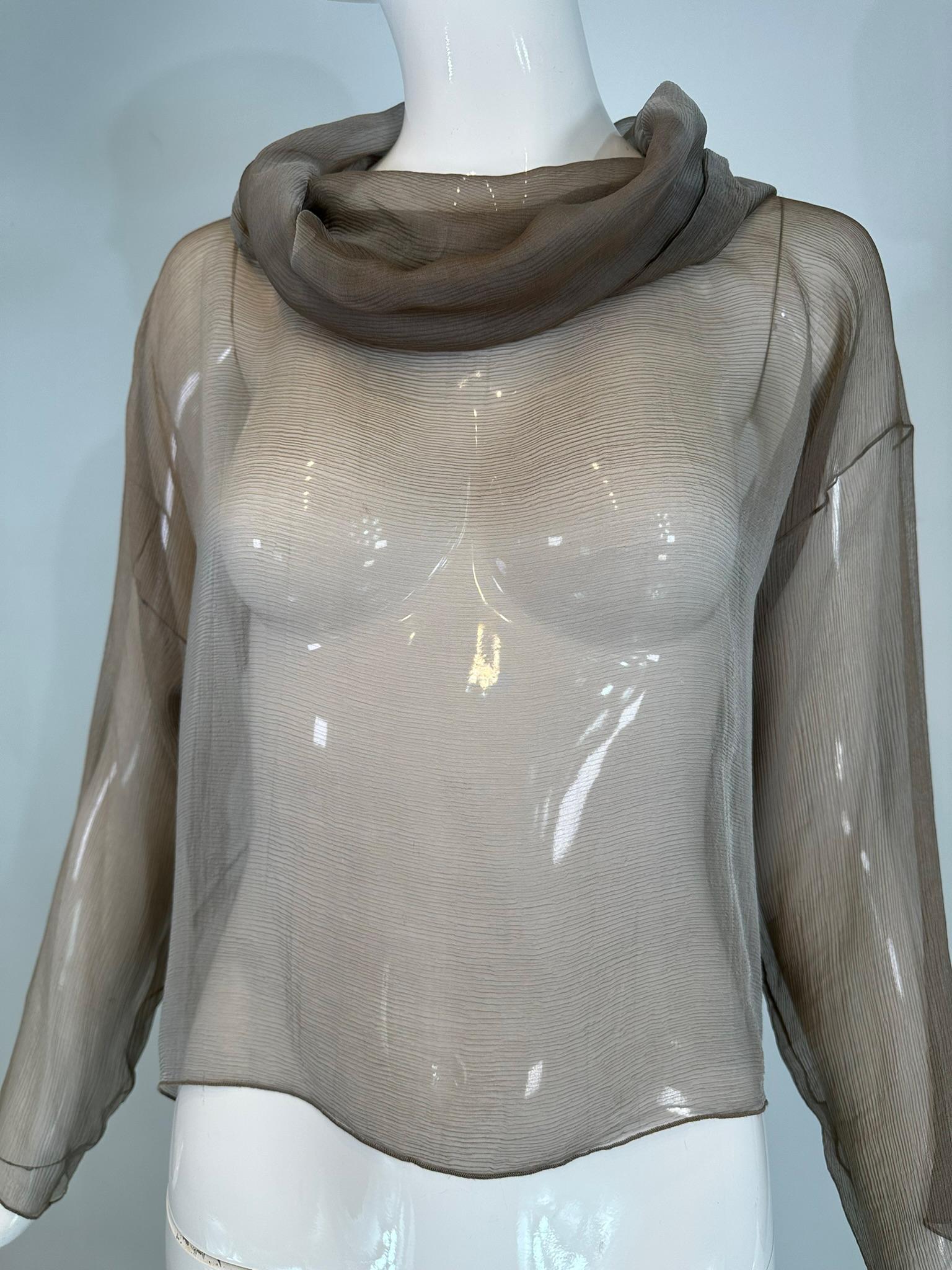  Beautiful silvery taupe sheer silk draped turtle neck, long sleeve pull over top. Elegant simplicity was Zorans craft & why women who love his clothing still seek his pieces. 
The fabric is sheer silk with a delicate horizontal weave, perfect for