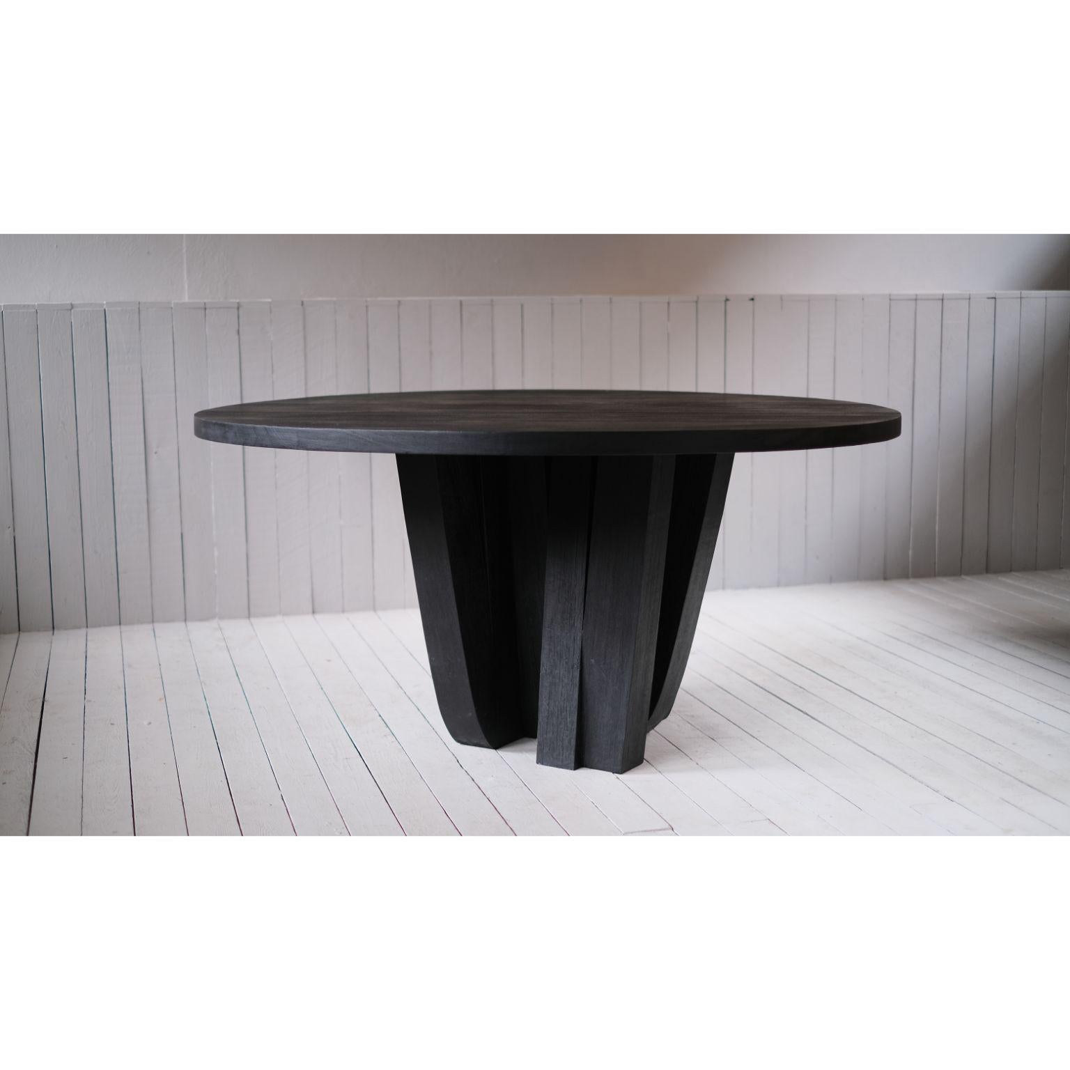 Zoumey table round small by Arno Declercq
Dimensions: D 160 x H 70 cm
Materials: Burned and waxed Iroko wood.
Signed by Arno Declercq

**They come without a table top.

A forest of table legs made out of 16 solid pieces of Iroko wood, burned