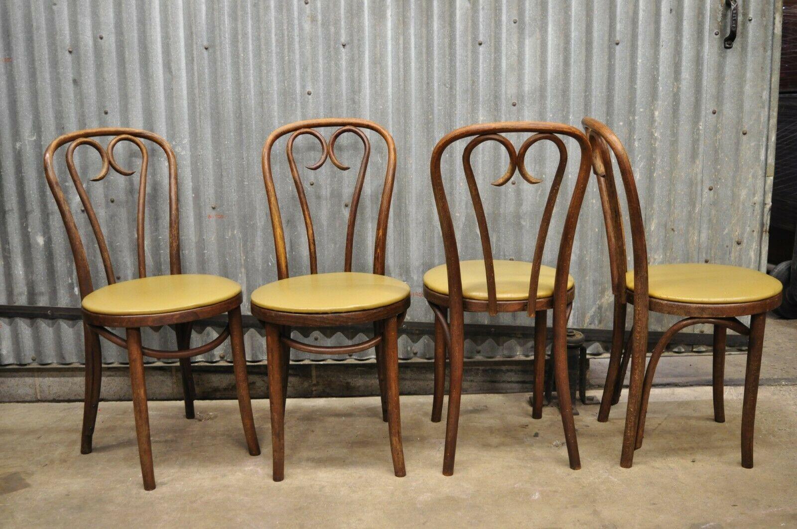 ZPM Radomsko Poland Bentwood Sweetheart Bistro Dining Chairs - Set of 4. Listing includes (4) side chairs, bentwood frames, round vinyl seats, original label, very nice vintage antique set. Circa Early 1900s. Measurements: 35