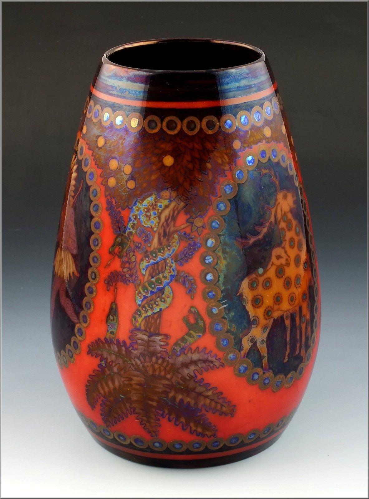 European art pottery vase of nice form, decorated with oval views of American Indian and deer. Between the views are snakes coiled around fruit trees and it is finished in an eosin glaze. It has the Zsolnay Pecs raised pallet mark on the