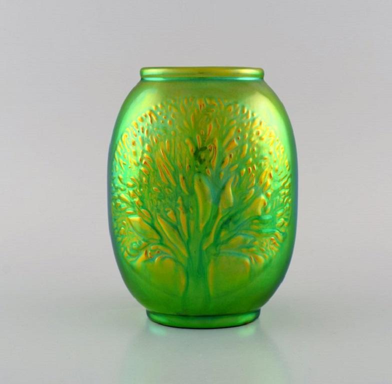 Zsolnay vase glazed ceramics with a tree in relief. Beautiful luster, eosin glaze. 
20th century.
Measures: 17 x 13 x 8.5 cm.
In excellent condition.
Stamped.