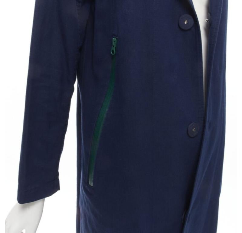 ZUCCA navy blue cotton linen green zipper over coat S
Reference: JACG/A00085
Brand: Zucca
Material: Cotton
Color: Navy, Green
Pattern: Solid
Closure: Snap Buttons
Lining:  Unlined
Extra Details: Packable green nylon hood at collar. Snap button front