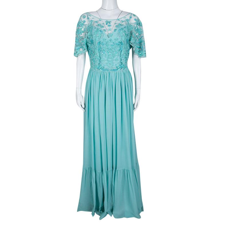 Look your best in this blue creation from the house of Zuhair Murad. The gown carries floral embellishments and embroidery on the bodice and a flowy skirt. It can be made more alluring by adding the right kind of accessories. Dress up in this