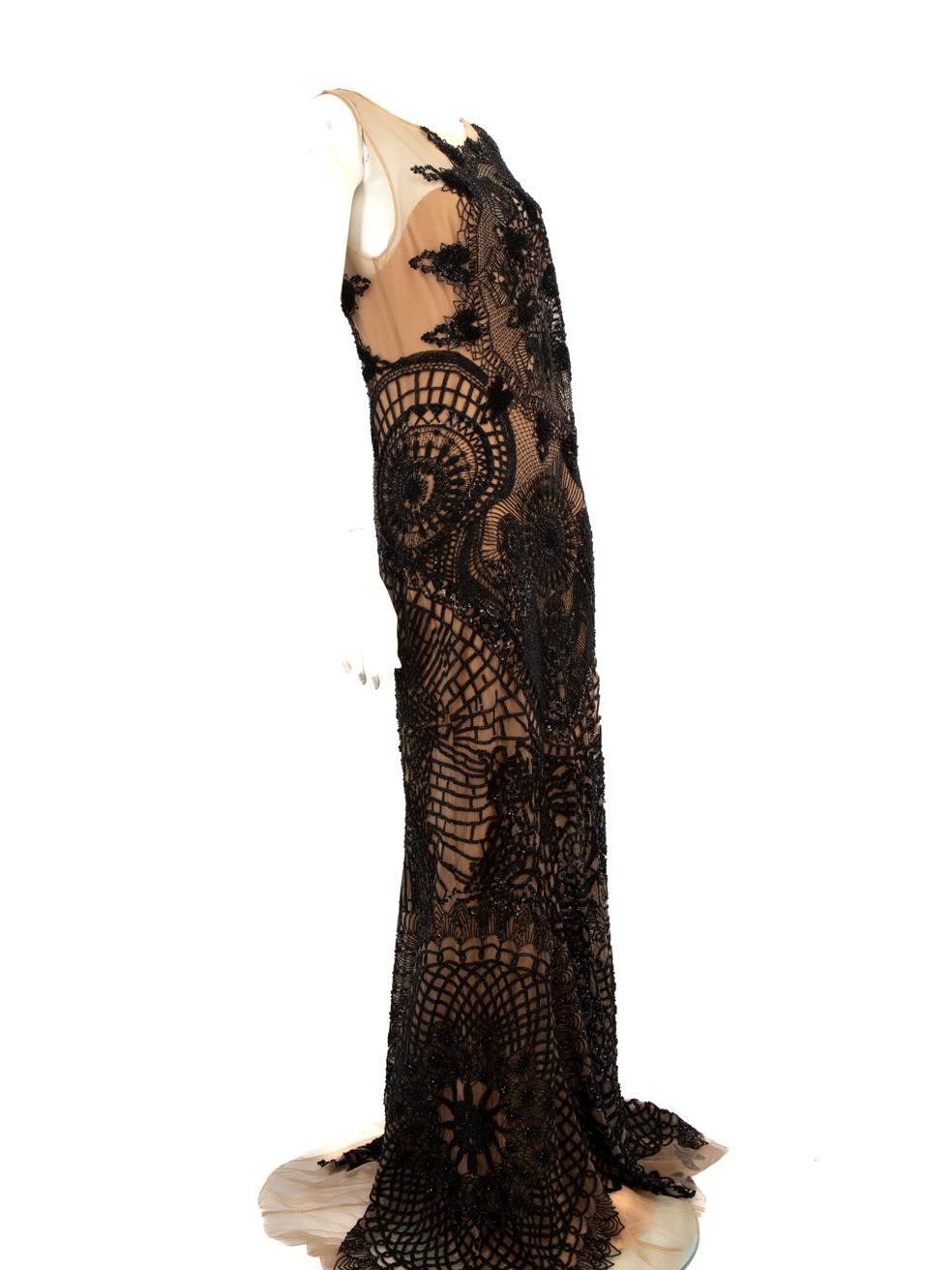 CONDITION is Very good. Minimal wear to the dress is evident. Plucks to the weave across the front and back of this used Zuhair Murad designer resale item.
  
  Details
  
  
  Black & Beige
  
  Synthetic 
  
  Gown 
  
  See through top
  
 