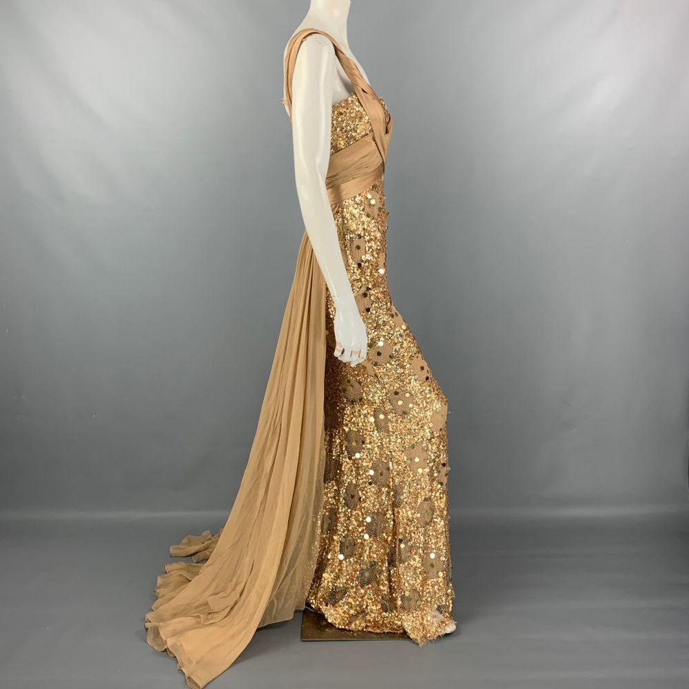 ZUHAIR MURAD 

Comes in a beige & gold silk blend with a slip liner featuring a ruched bodice, sequined details, crossover straps, and a back zip up closure

Content: Cotton - elastane

Size EU 40 - 4

 Bust: 30 inches
 Waist: 24 inches
 Hip: 30