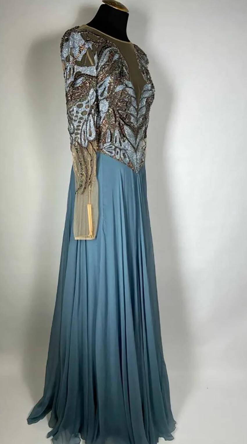 ZUHAIR MURAD

BLUE CHIFFON LONG GOWN DRESS
Embroidered with glass and crystals 

Long transparent sleeves
Back zipper closure

Content: 92% viscose, 2% elastane 

Size IT 38 - US 2

Pre-owned, very good condition.
Small defects on the skirt are