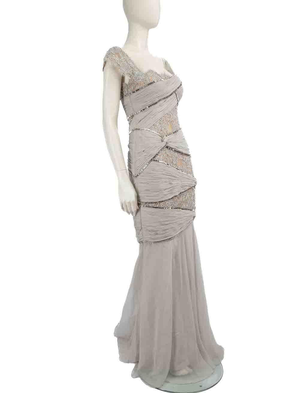 CONDITION is Very good. Minimal wear to the dress is evident. Minimal wear to the front and back on the hemline and the inside lining near the zip is seen with discolouration marks and the left side near the upper chest on the lining has restitching