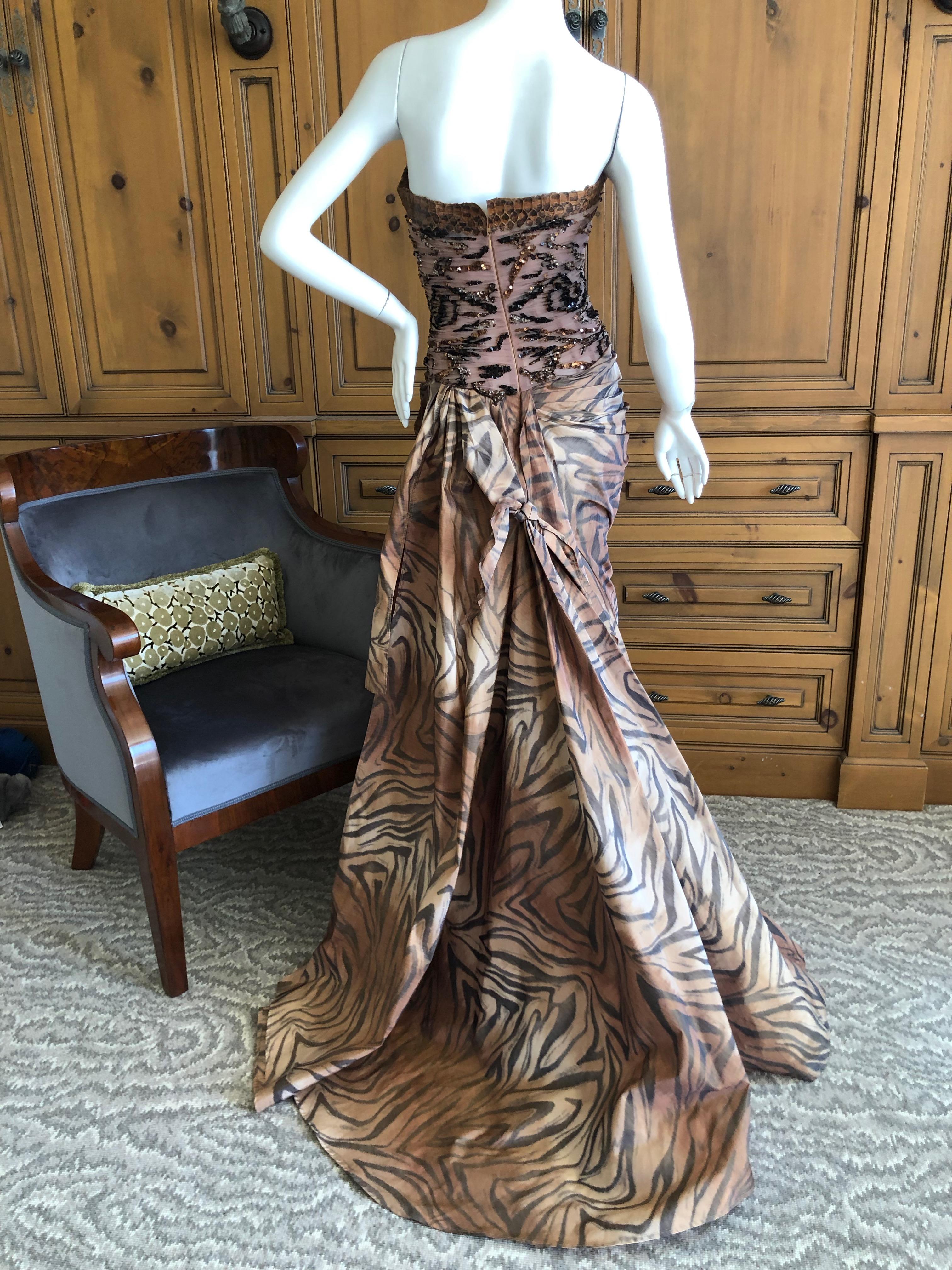 Zuhair Murad Haute Couture VIntage Tiger Print Silk Evening Gown with Inner Corset.
This is spectacular. There is an inner boned corset and train.
Trimmed in some type of reptile, I'm not certain if it is snake or alligator.
Sequin on netting at the
