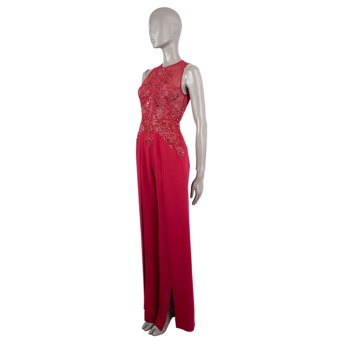 100% authentic Zuhair Murad beaded jumpsuit in magenta silk (75%) and polyamide (25%). Features a round neck, a sleeveless cut and slits on the outer leg on both sides. Has a cut-out on the back and a generally beaded top. Closes with a zipper on