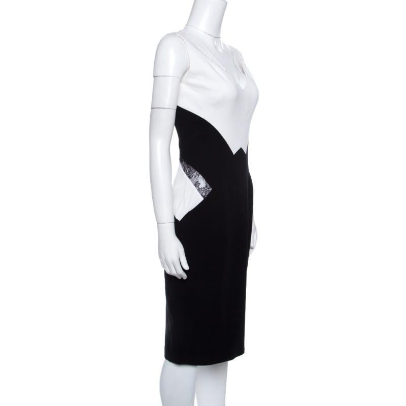 Masterfully constructed into a flattering silhouette, this sleeveless dress will make a perfect piece for evening outings. This monochrome dress, featuring a colorblock pattern and lace inserts on the sides, also comes with a zip to create a