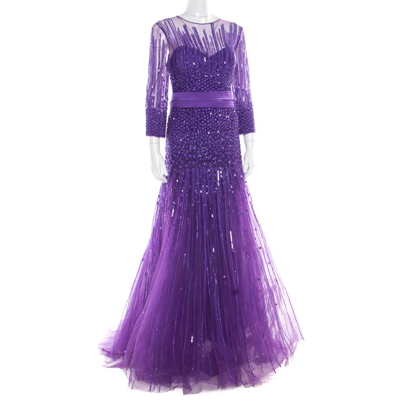 A perfect outfit to get your ready for parties and special events, this breathtaking gown from Zuhair Murad is sure to steal your heart. Constructed in a pretty purple silk blend, this dress features a beautifully embellished bodice that adds