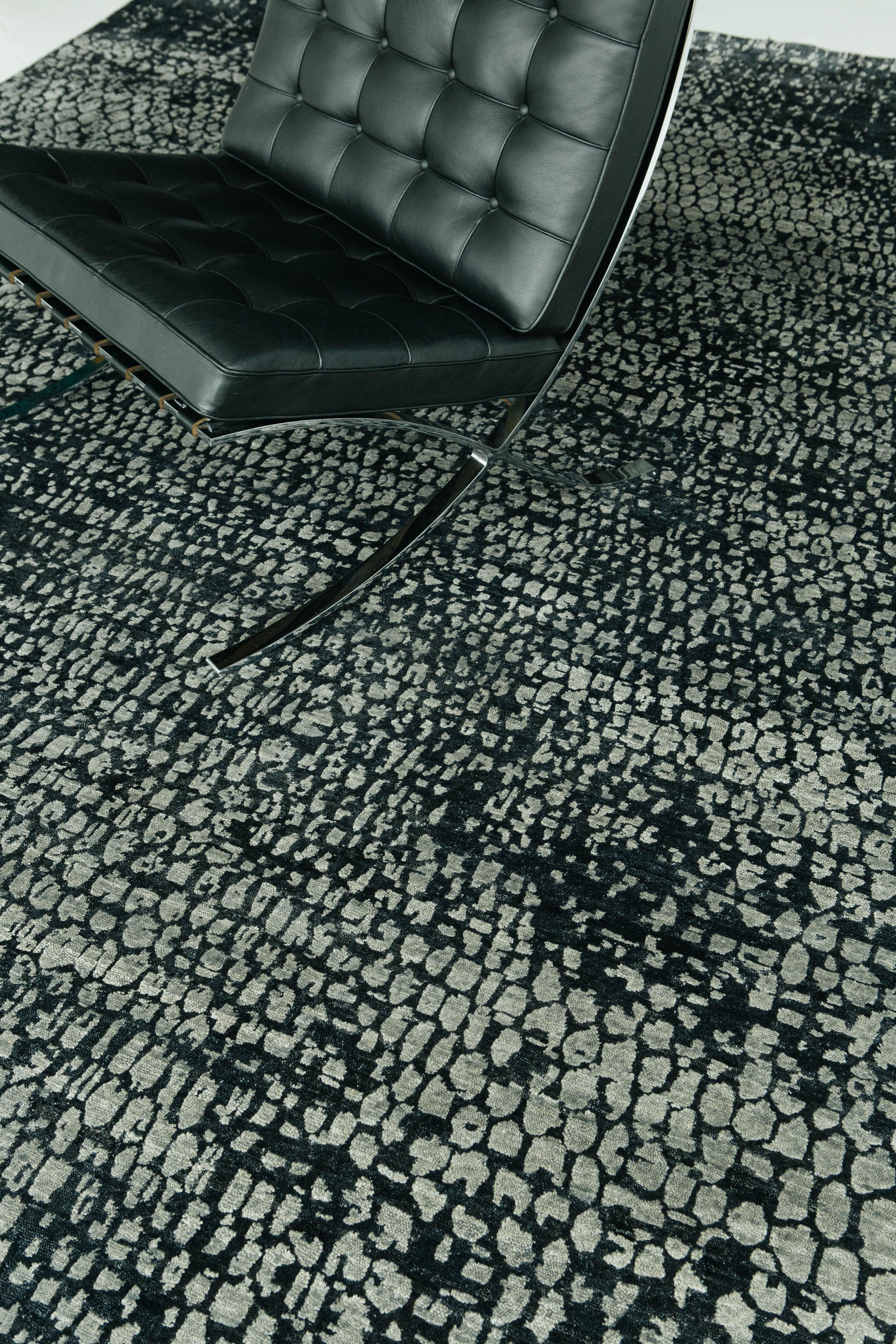 This unique piece from our Elan Collection identified by its deeply contrasting embossed design that is eye catching and unique. Its lustrous midnight blue and grays create scale-like shapes motifs that are timely and luxurious.

Rug Number