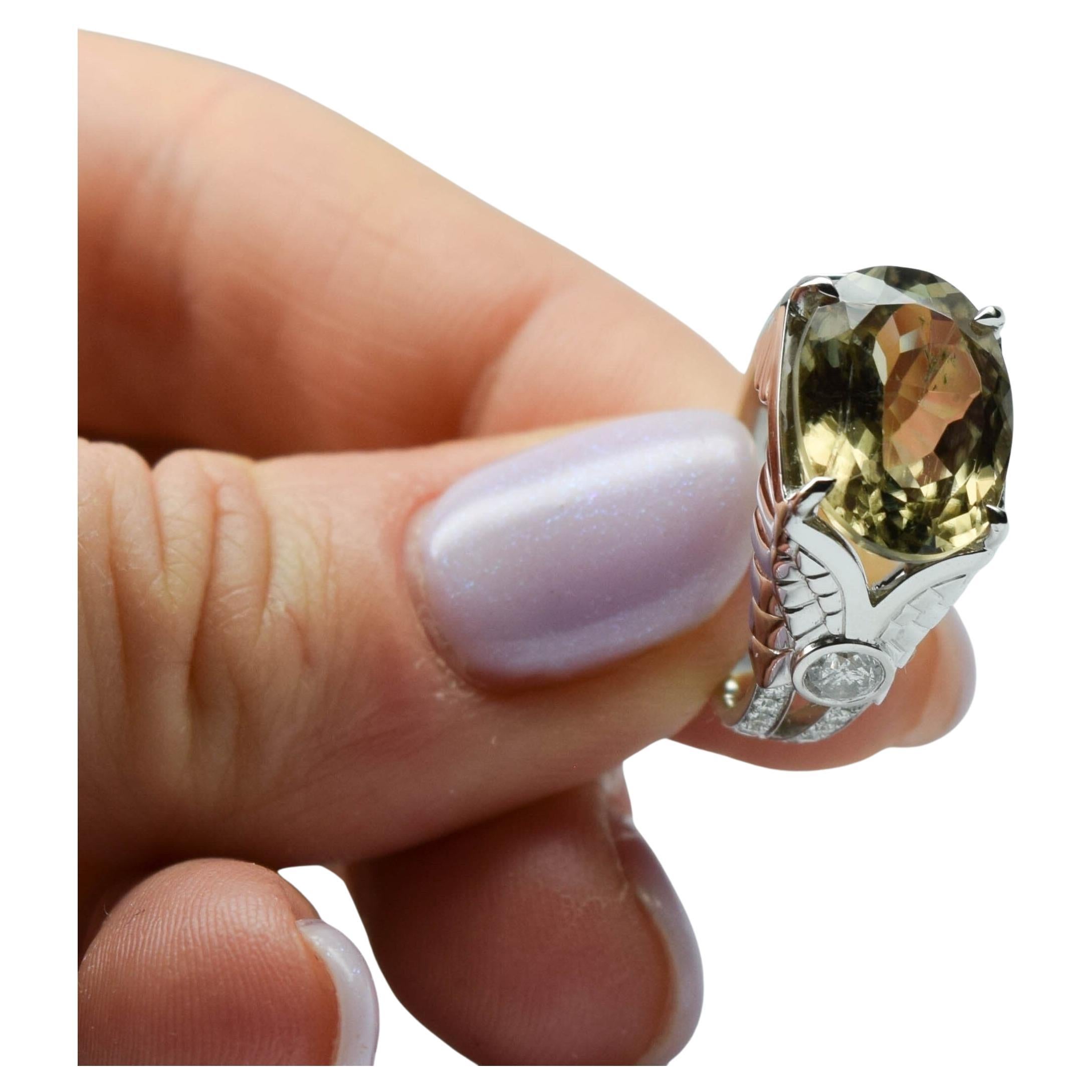 Zultanite Diamond ring in 18KT white gold, excellent craftsmanship, rare details, hand engraved. Very complex ring with a character. Zultanite is a change color gemstone it changes color from green to pink under different light settings. Size 8, can