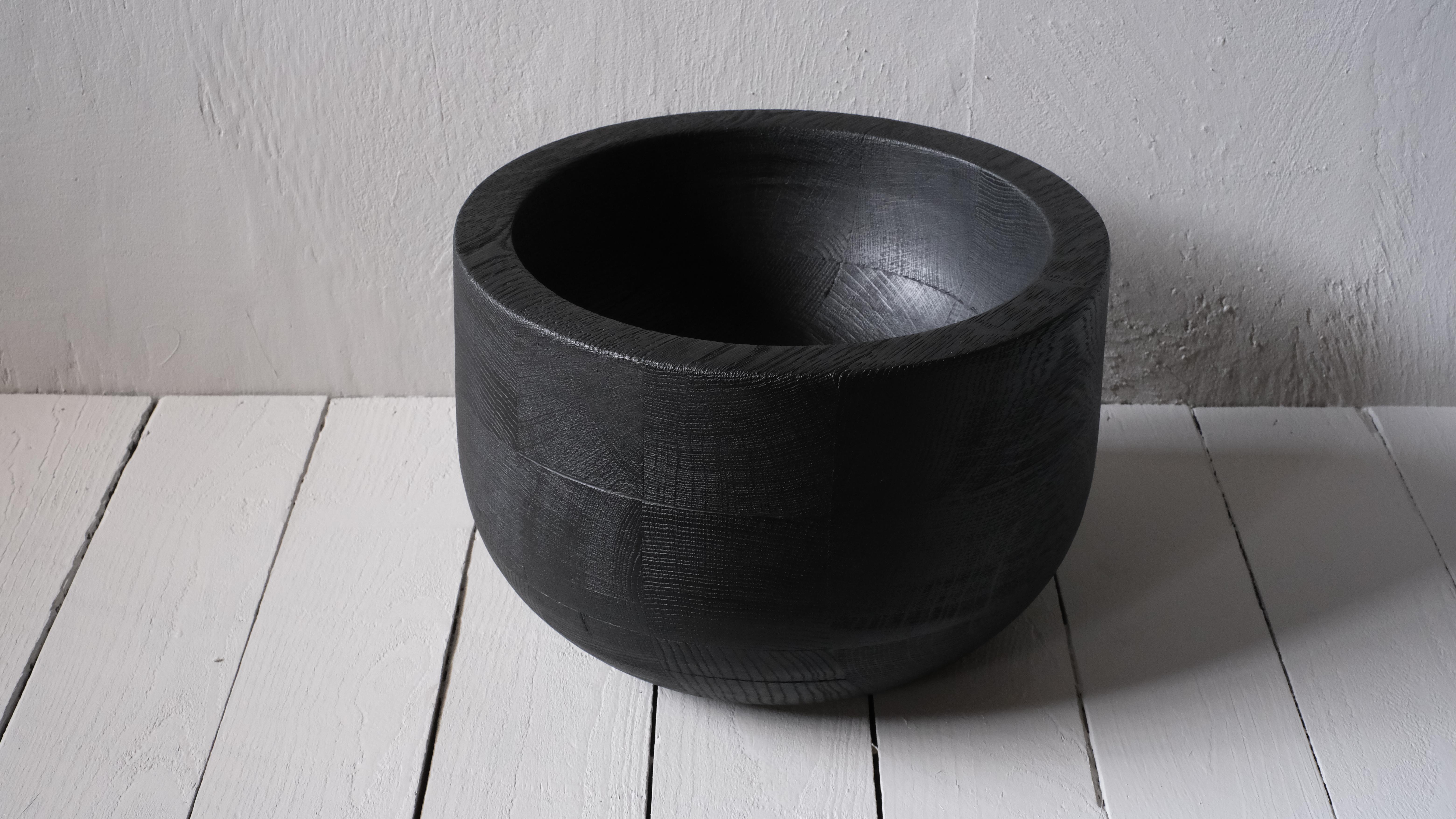 Zulu Bowl by Arno Declercq
Dimensions: D 30 x W 30 x H 20 cm. 
Materials: burned and waxed oak.

Arno Declercq
Belgian designer and art dealer who makes bespoke objects with passion for design, atmosphere, history and craft. Arno grew up in a family