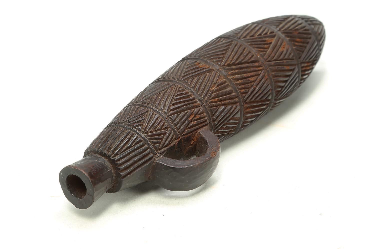 Zulu Tribal carved wood Snuff Container, South Africa

A finely carved snuff container with finely carved incised great geometric designs, a great example of the detailed work the Zulu are known for. Early 20th century, 7 inches high, in very good