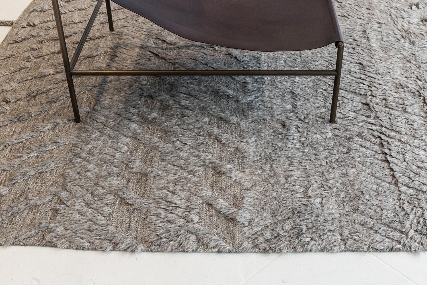 A plain and simple Zuma rug from ZigZigZag collection that features a zigzag pile weave pattern. This phenomenal work of art gives the inspiration to enhance your contemporary interiors. A gray tone that gives extra to your Minimalist